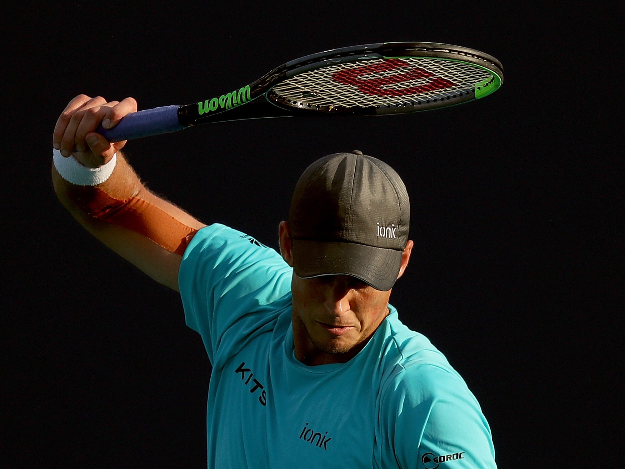 Vasek Pospisil of Canada winds up to smash his racquet