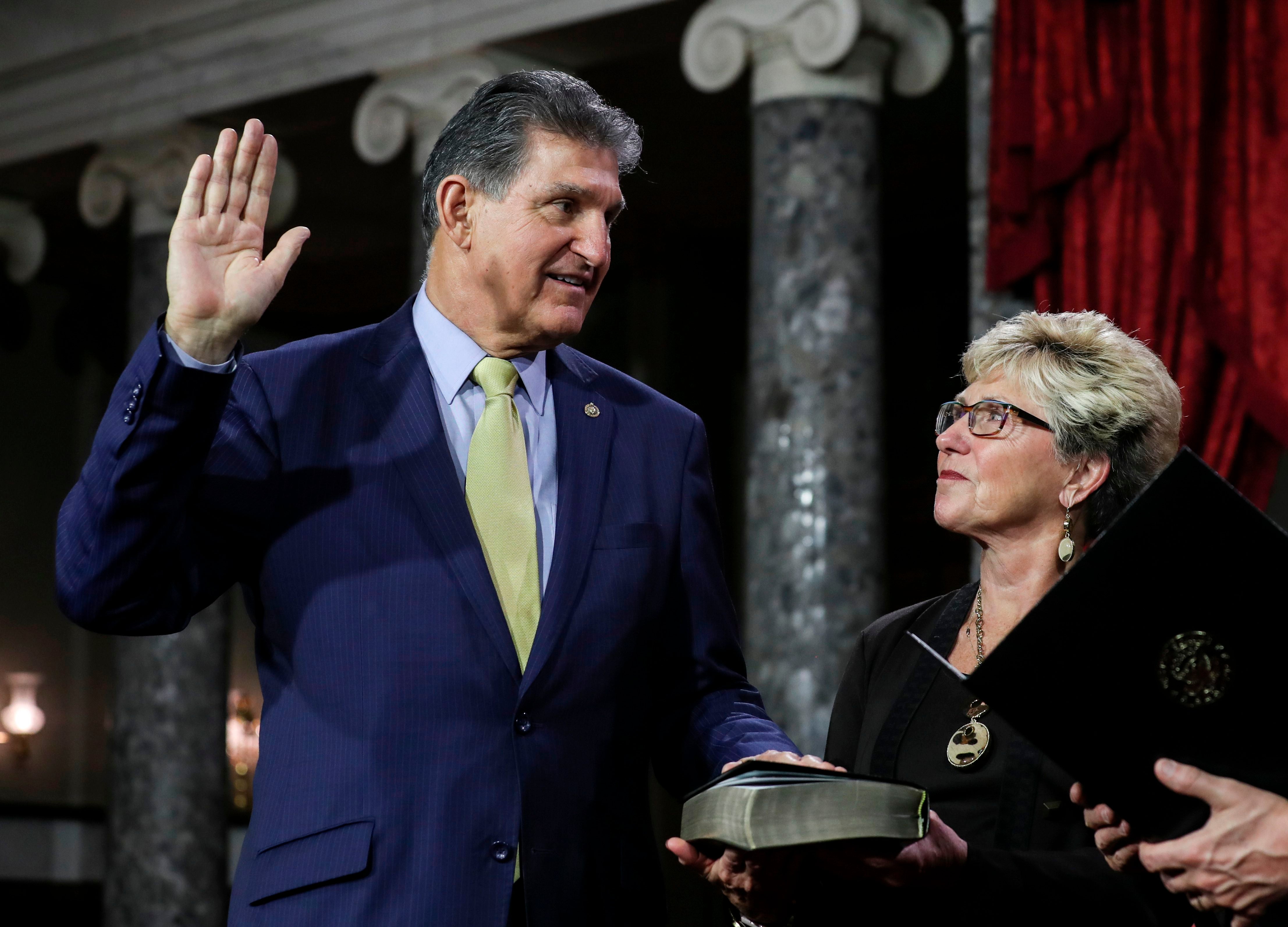 Joe and Gayle Manchin, pictured as he is sworn into office in 2019