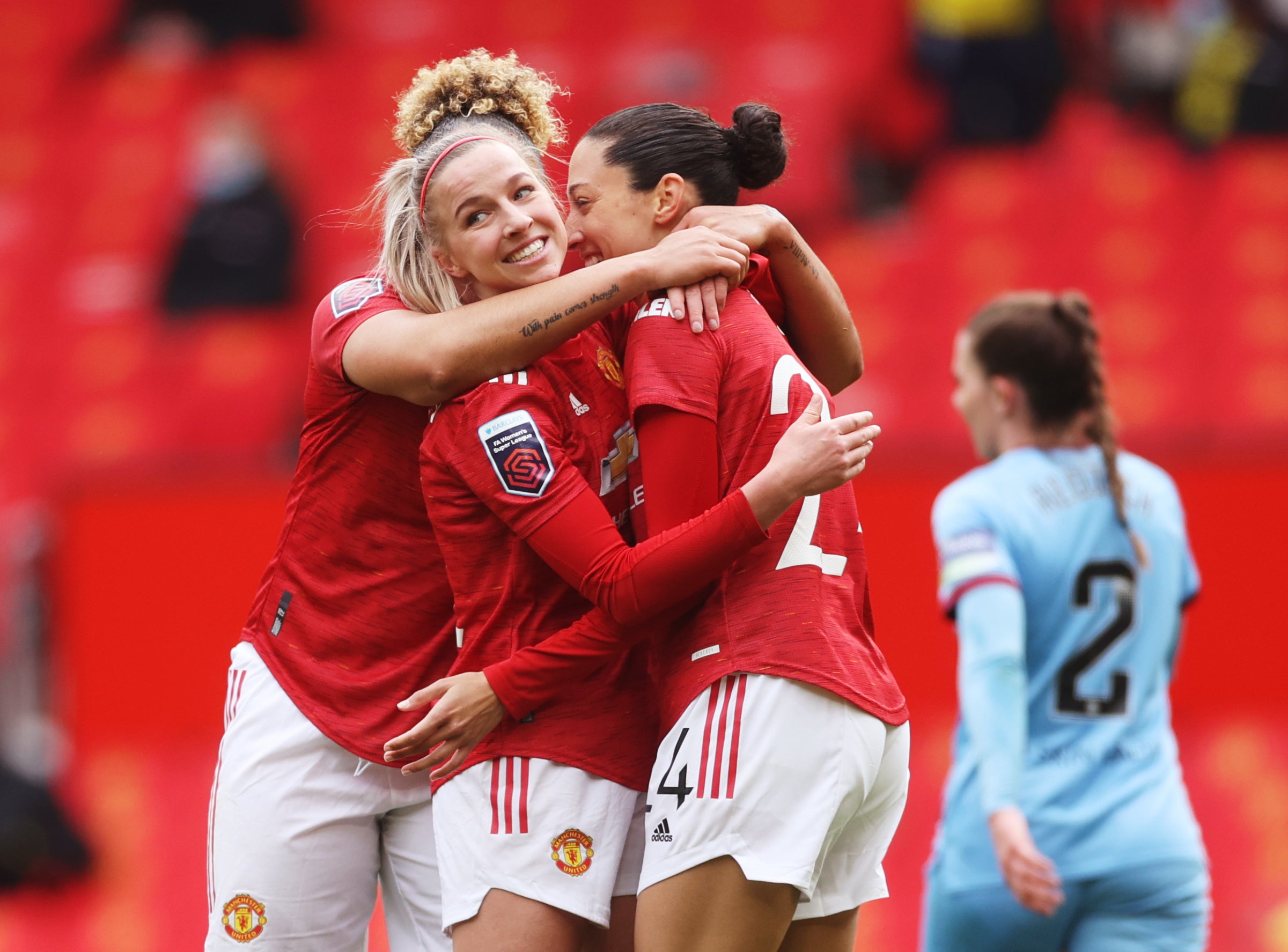 Christen Press, right, celebrates scoring United’s second goal