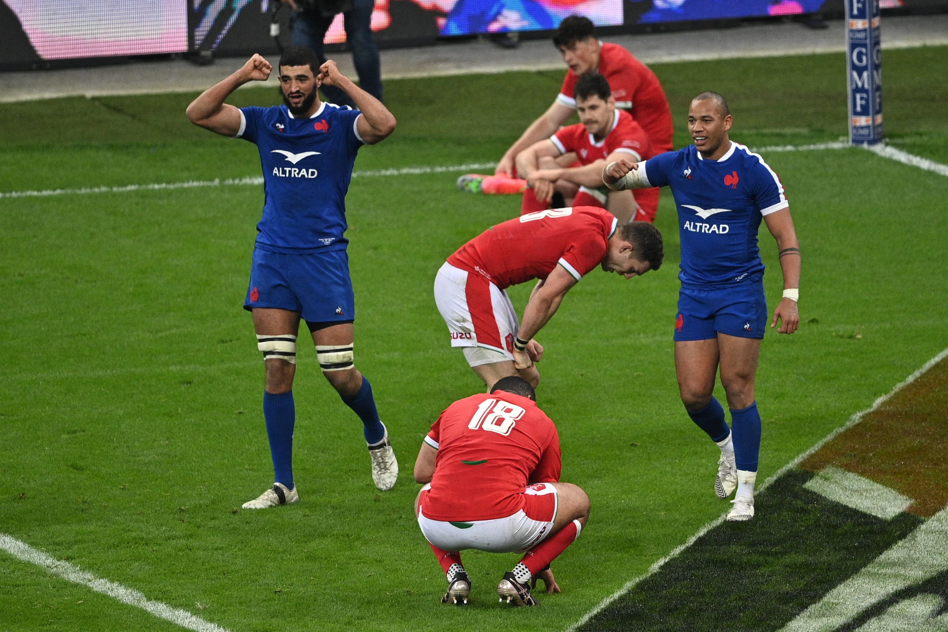 Swan Rebbadj and Gael Fickou celebrate a last-gasp win over Wales