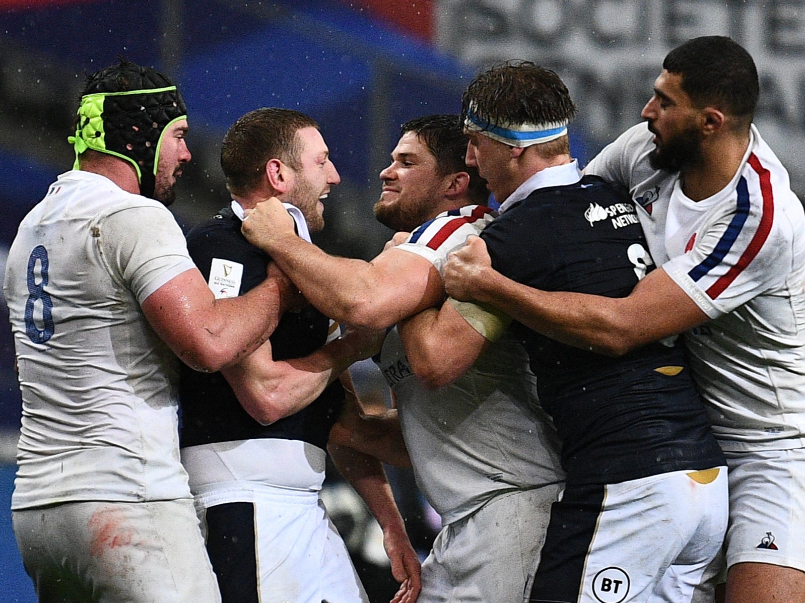 Finn Russell, of Scotland, scuffles with France hooker Julien Marchand