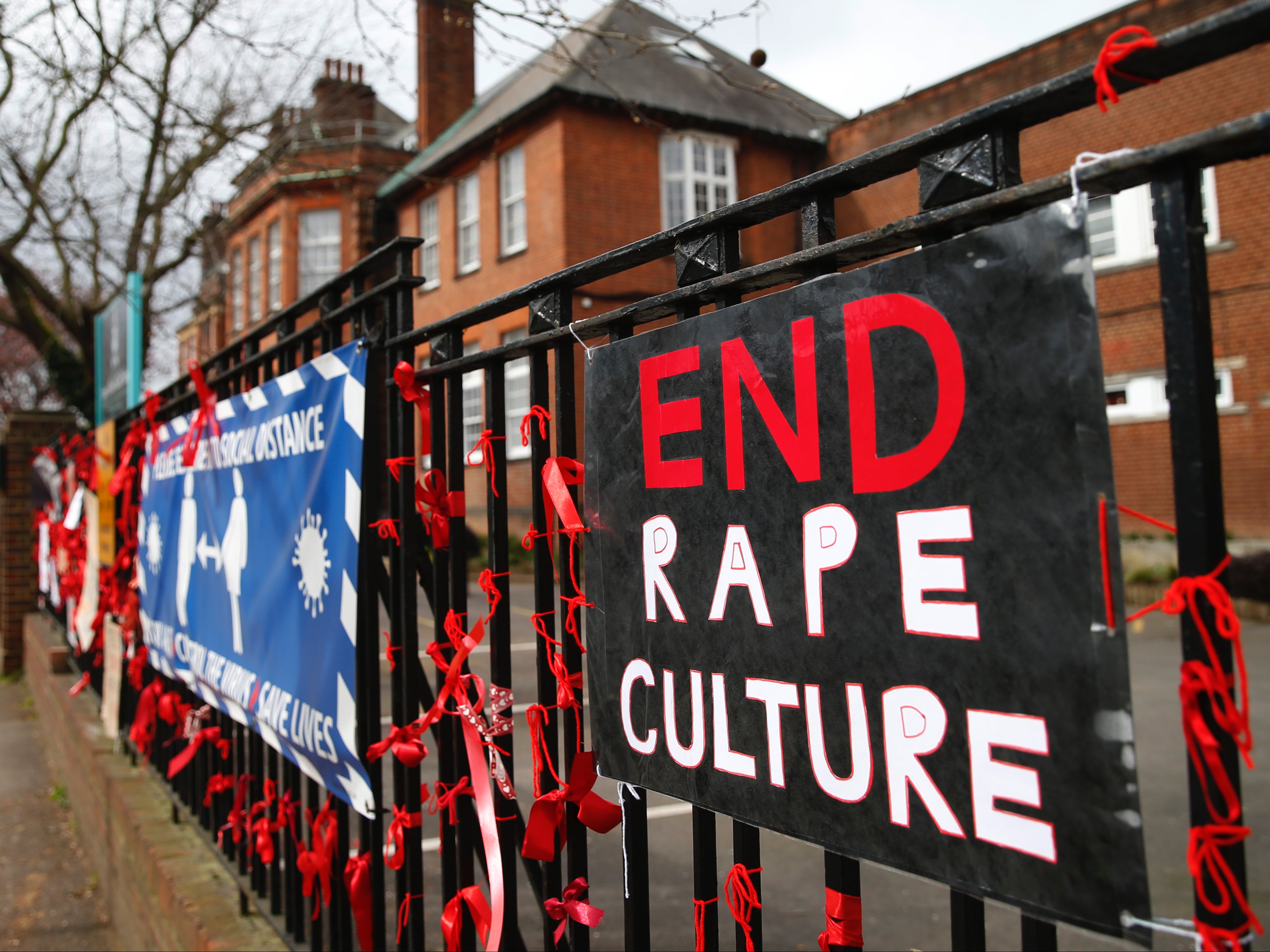 A placard reading ‘End Rape Culture’ attached to the fence outside James Allen’s Girls’ School in London