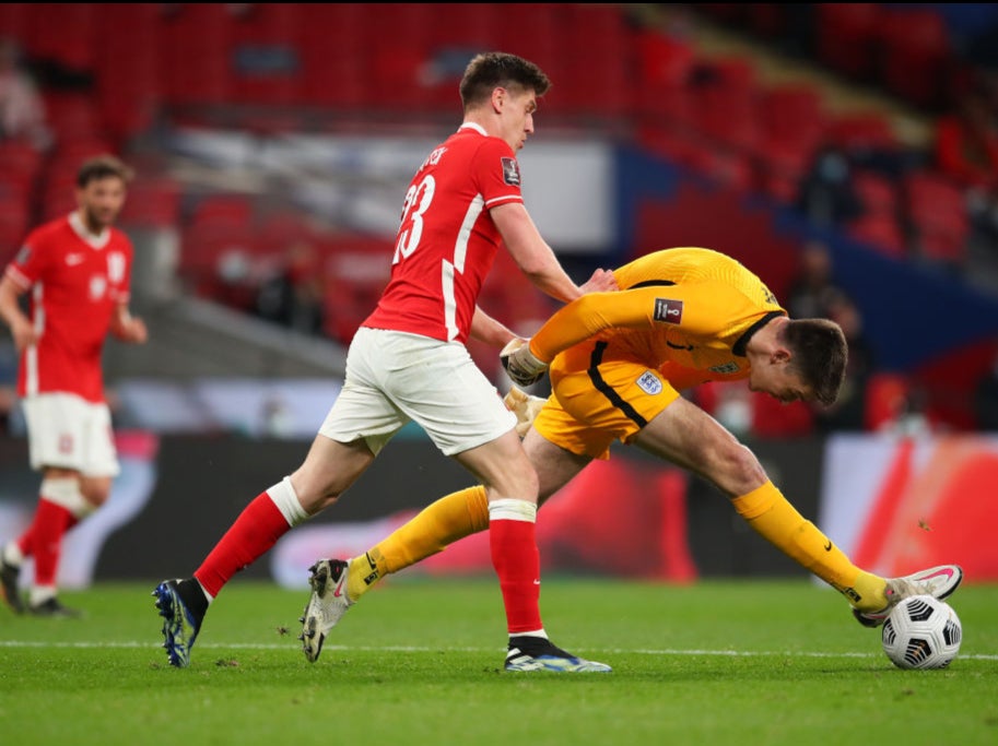 Nick Pope stretches to clear the ball against Poland