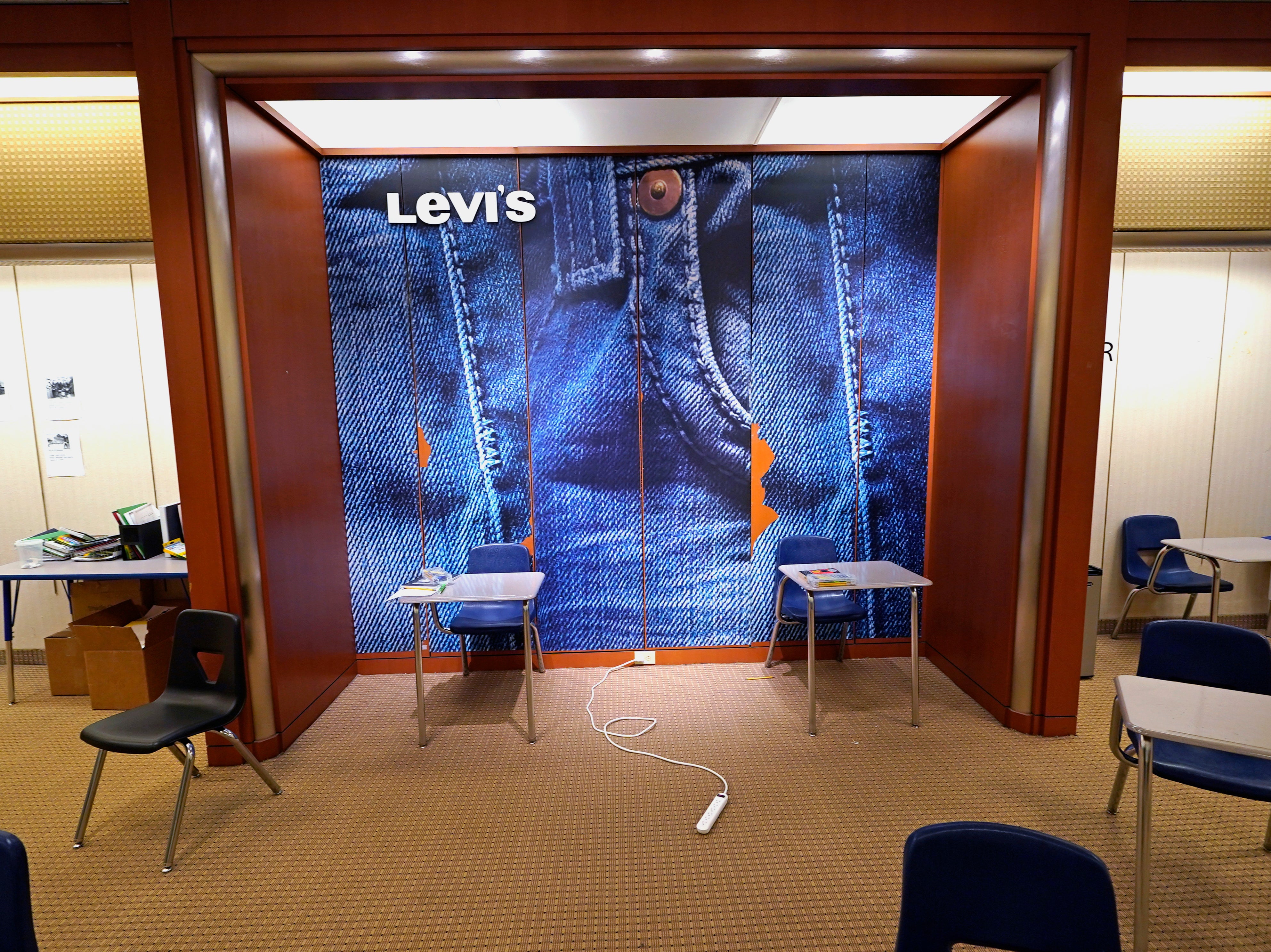 A large Levi’s jeans display highlights the center of an empty classroom, built in a former department store, at Downtown Burlington High School on Monday 22 March, 2021