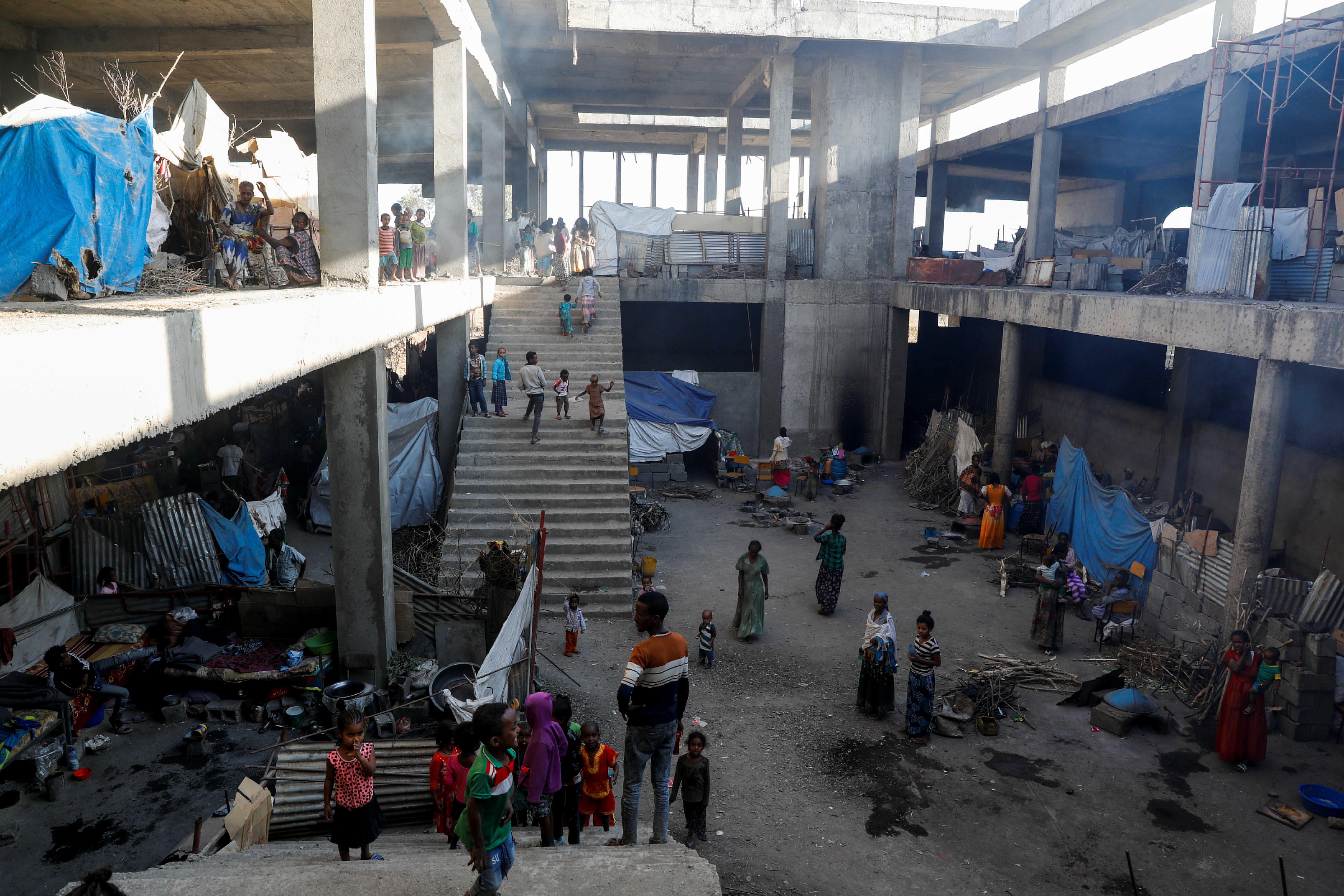 Displaced people inside a building under construction at the Shire campus of Aksum University, in Tigray