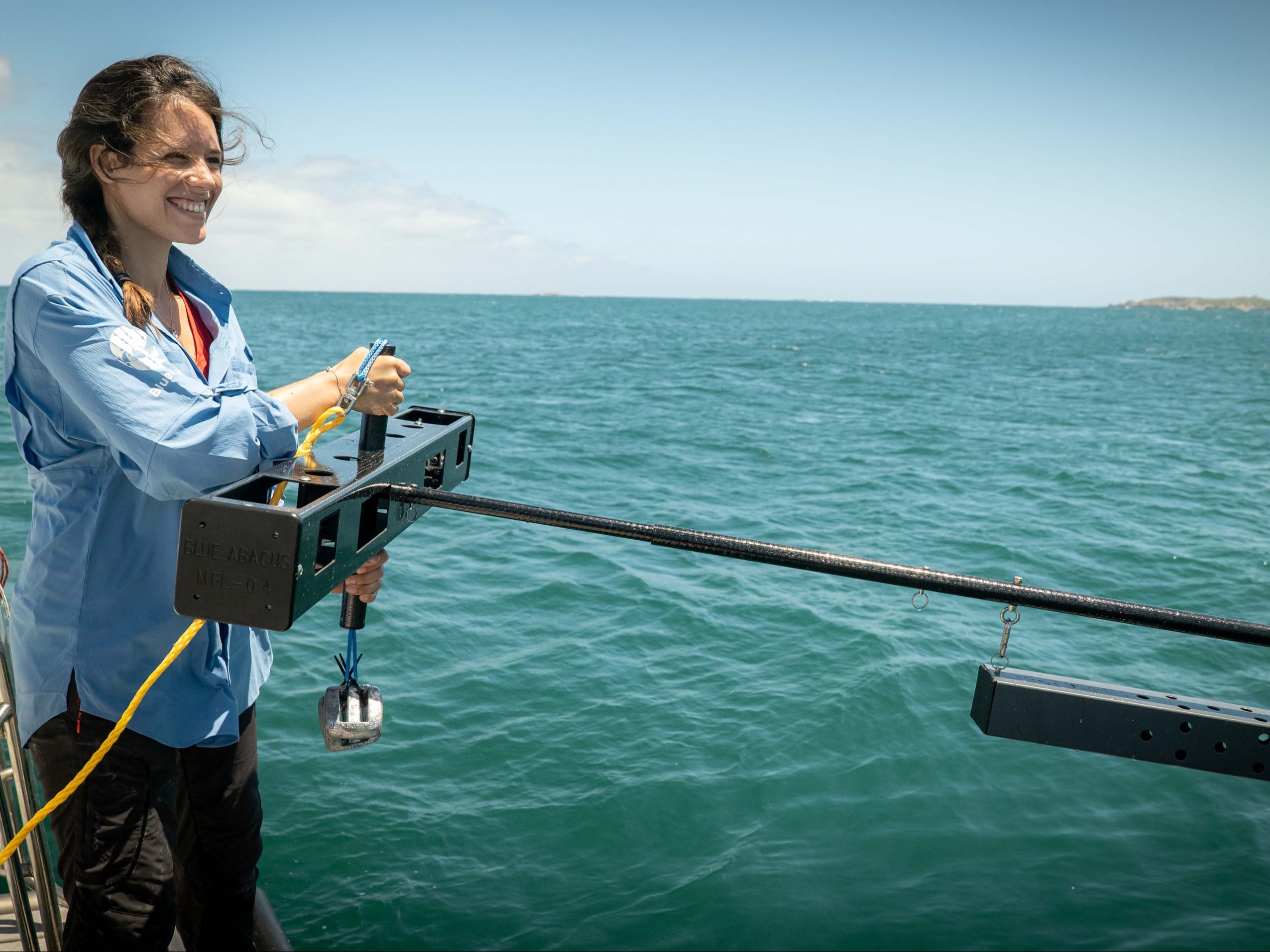 Researcher Naima Andreas Lopez with a midwater BRUVS