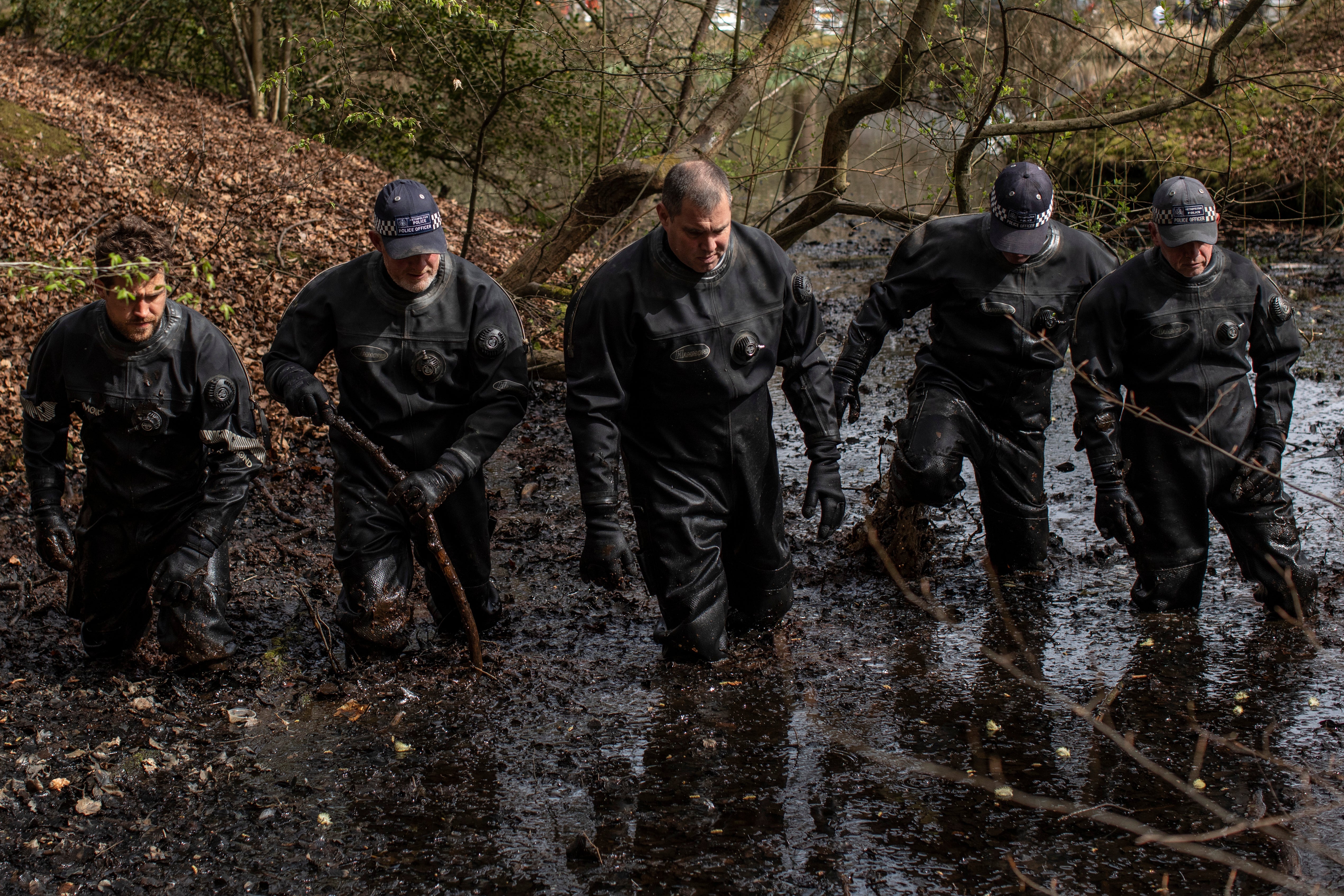 Police search a pond in Epping Forest