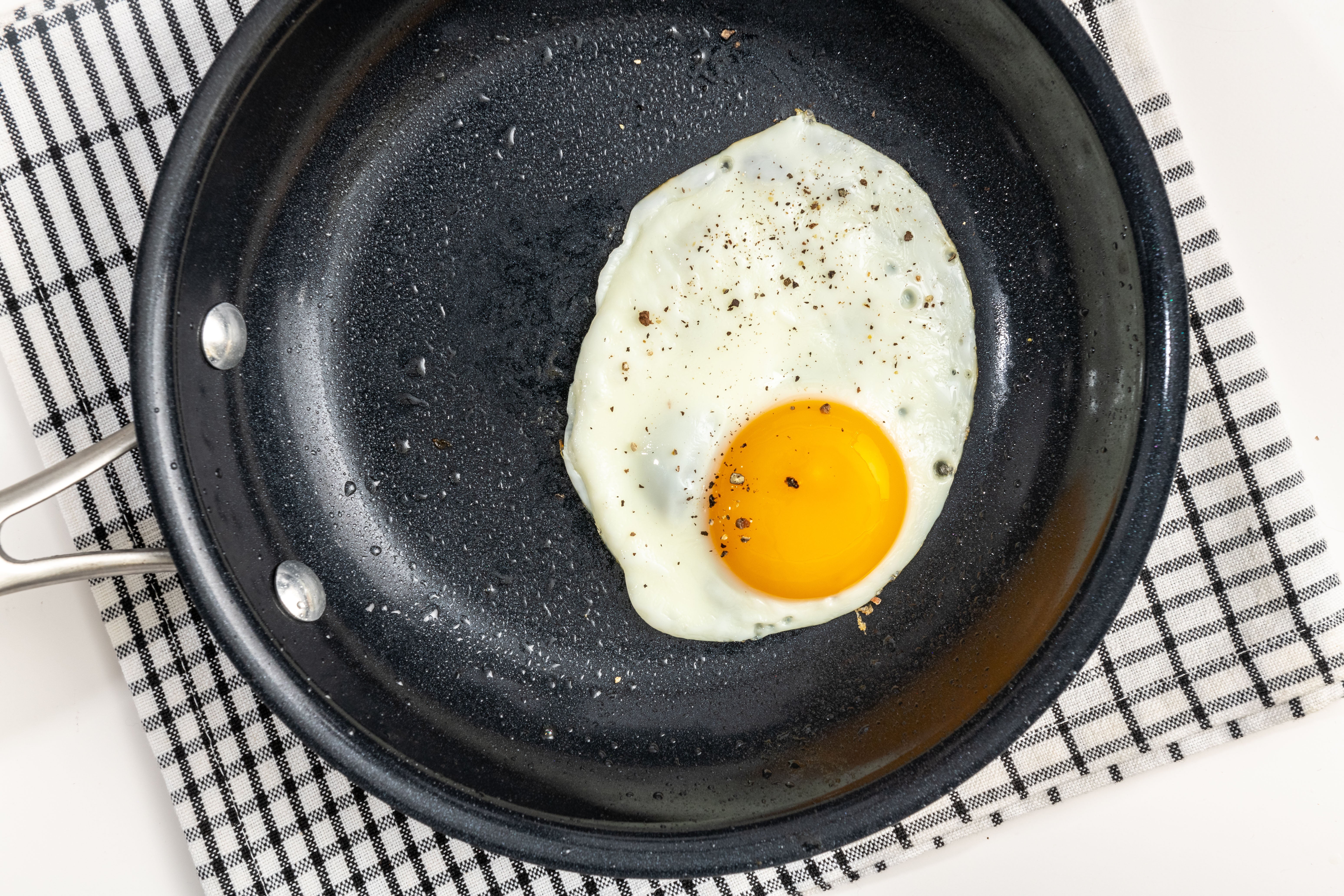 The gentle, indirect heat your oven provides cooks the white all the way through while keeping it tender and leaving the yolk golden