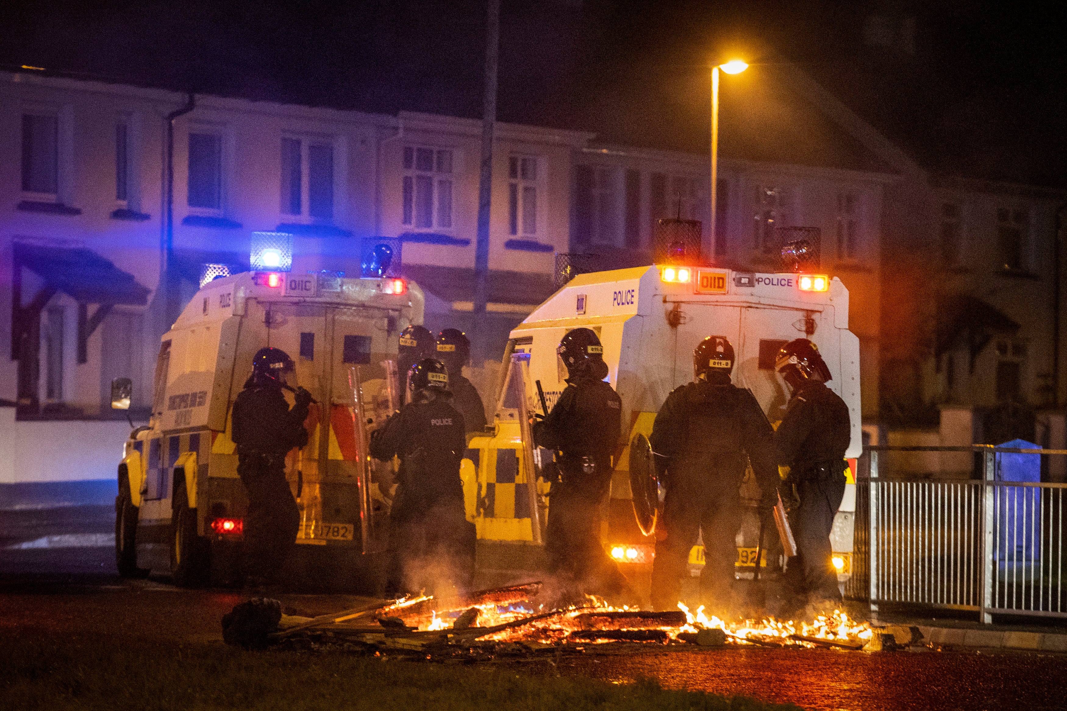 PSNI Tactical Support Group officers in attendance at the loyalist Nelson Drive estate in the Waterside of Derry City, Co. Londonderry, during a public order incident which saw a car being set alight and surrounding roads being blocked with fires