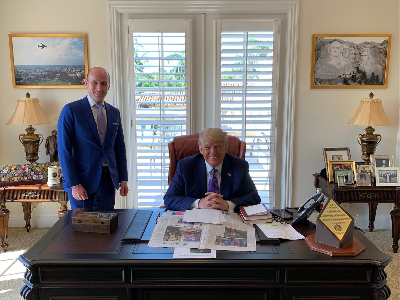 Miller, pictured with Trump at Mar-a-Lago in 2021, is leading efforts to deport undocumented migrants