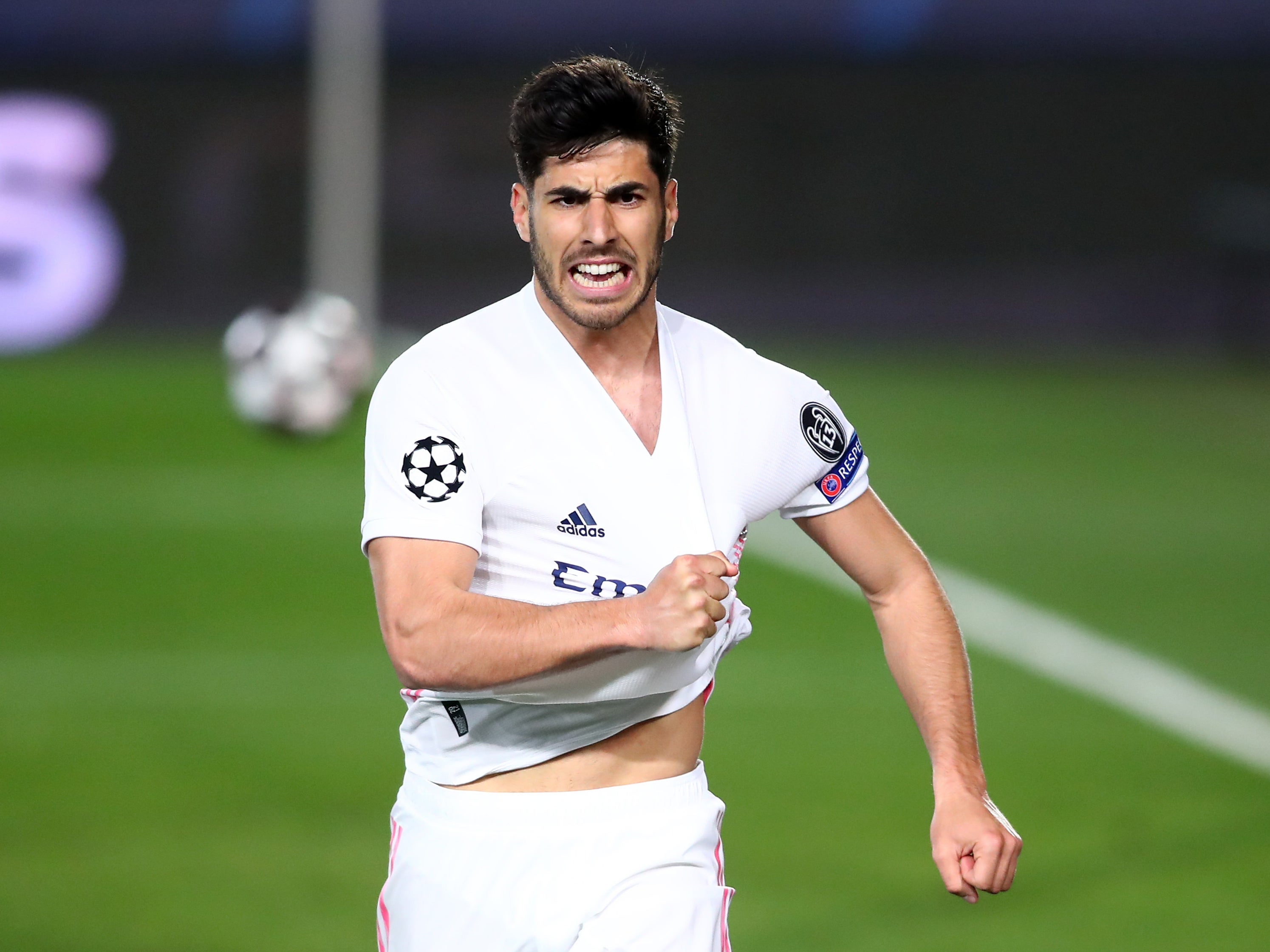 Marco Asensio celebrates scoring against Liverpool