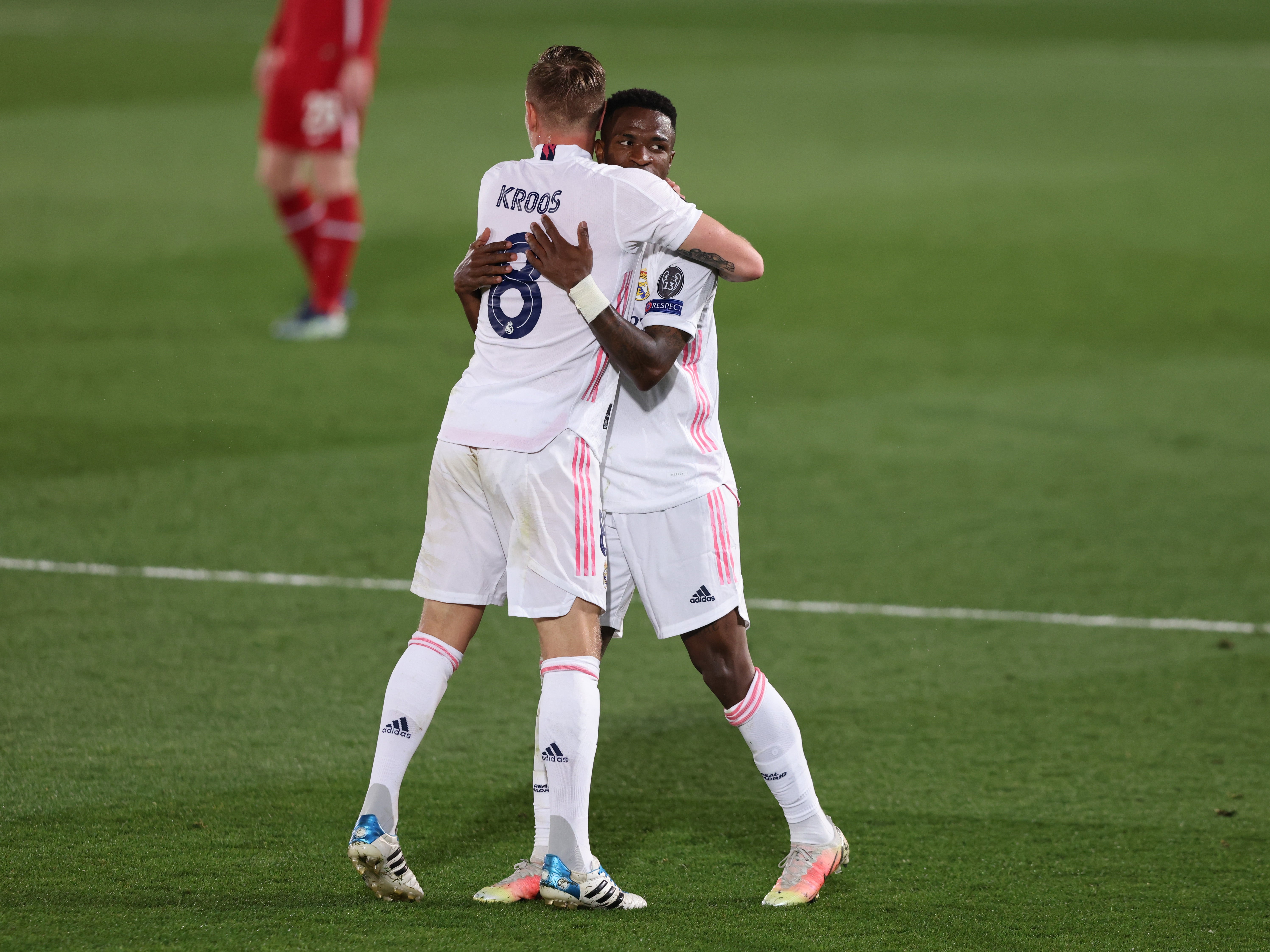 Vinicius Junior of Real Madrid celebrates with teammate Toni Kroos