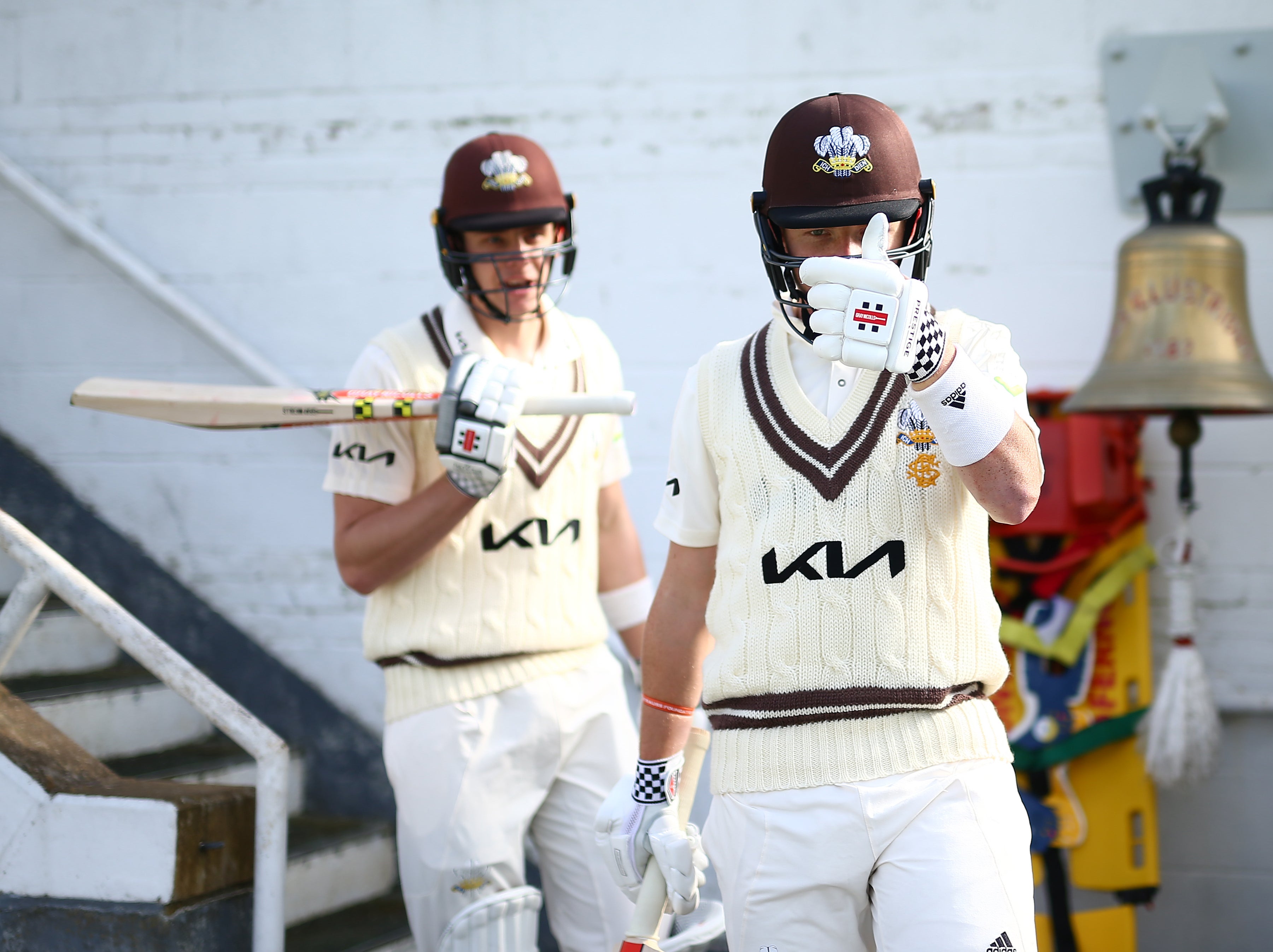 Ollie Pope and Jamie Smith of Surrey in action during a pre-season warm-up match