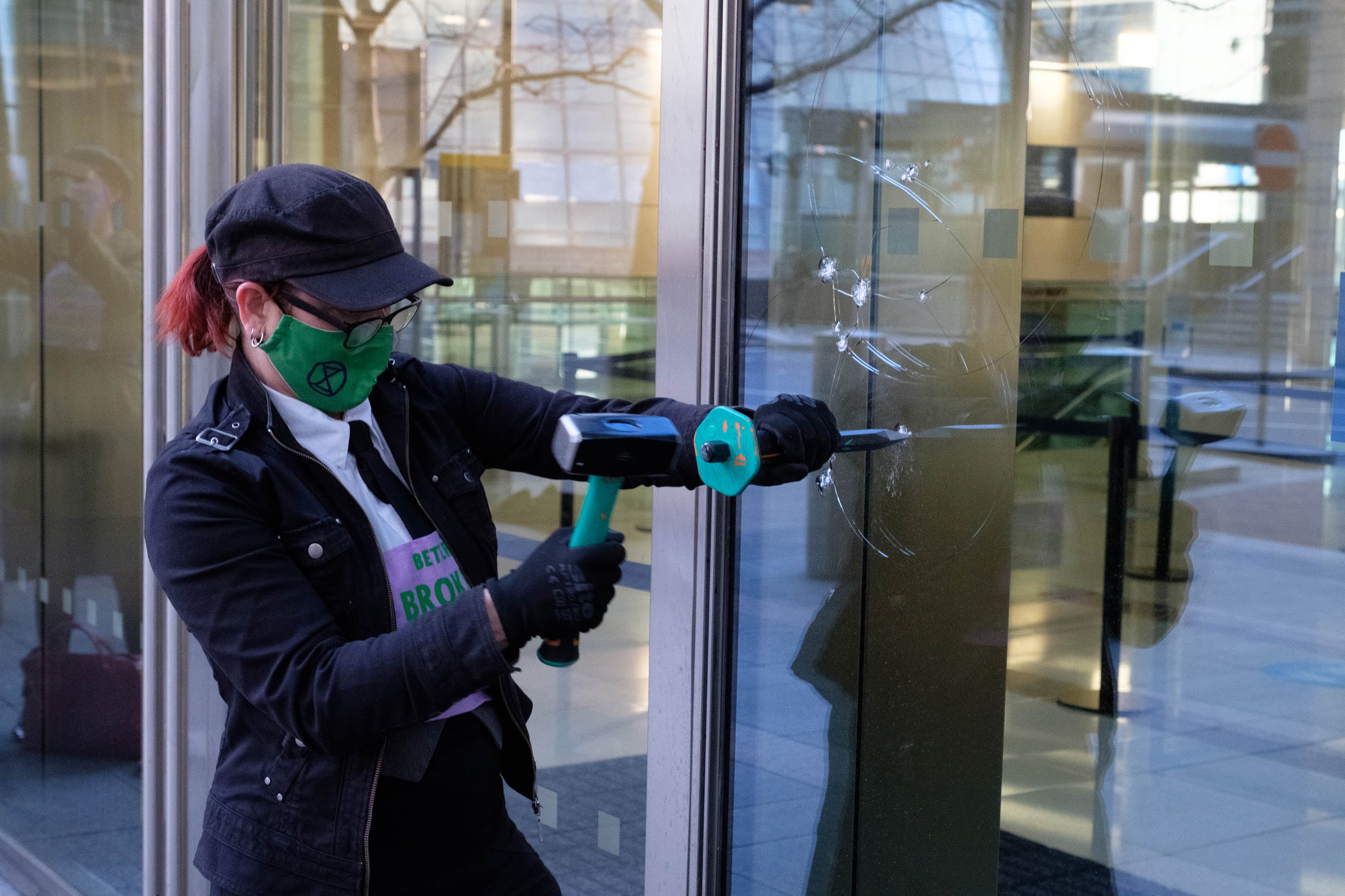 The protesters wore patches on their clothes that read ‘Better broken windows than broken promises'