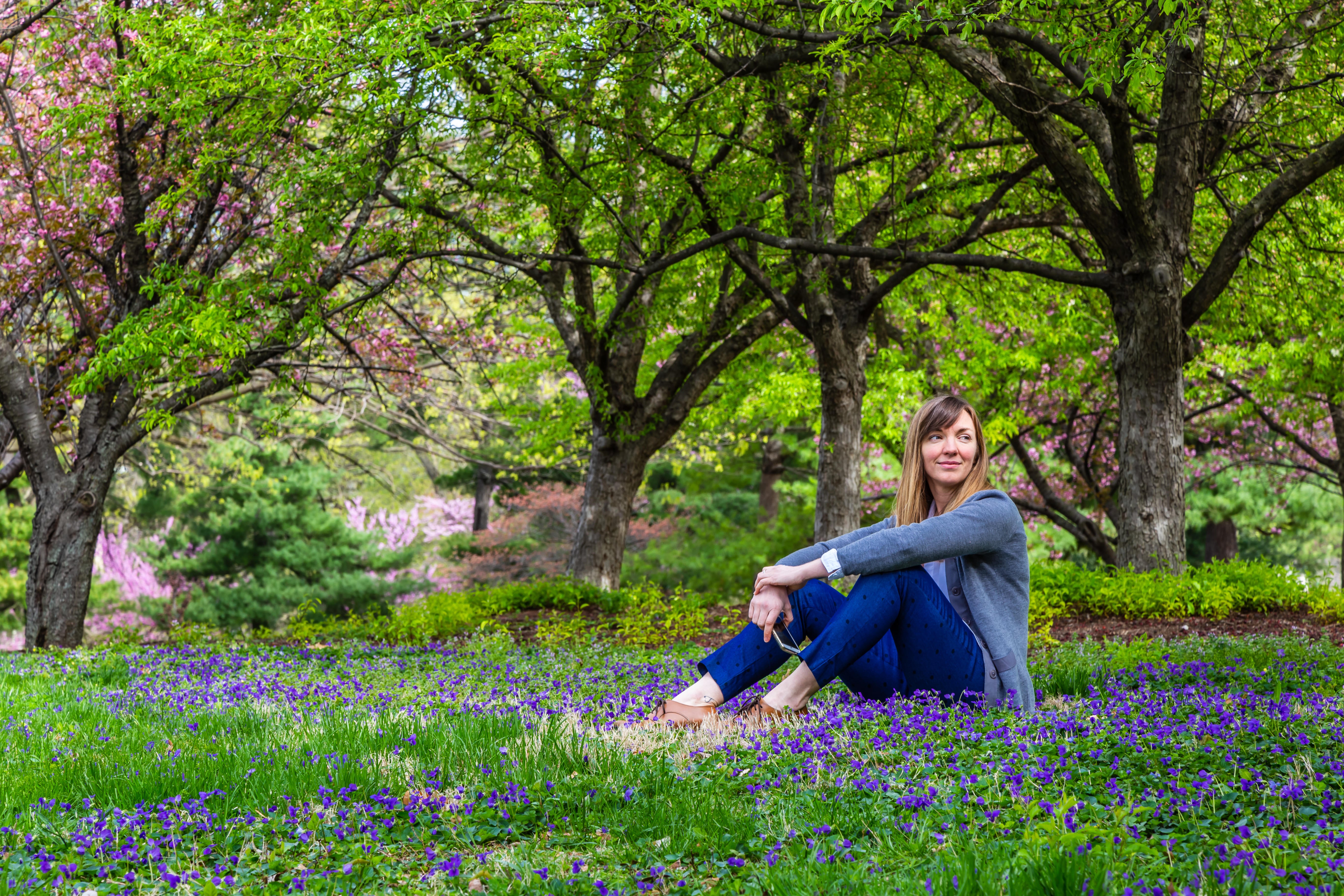 Woman sat in a meadow