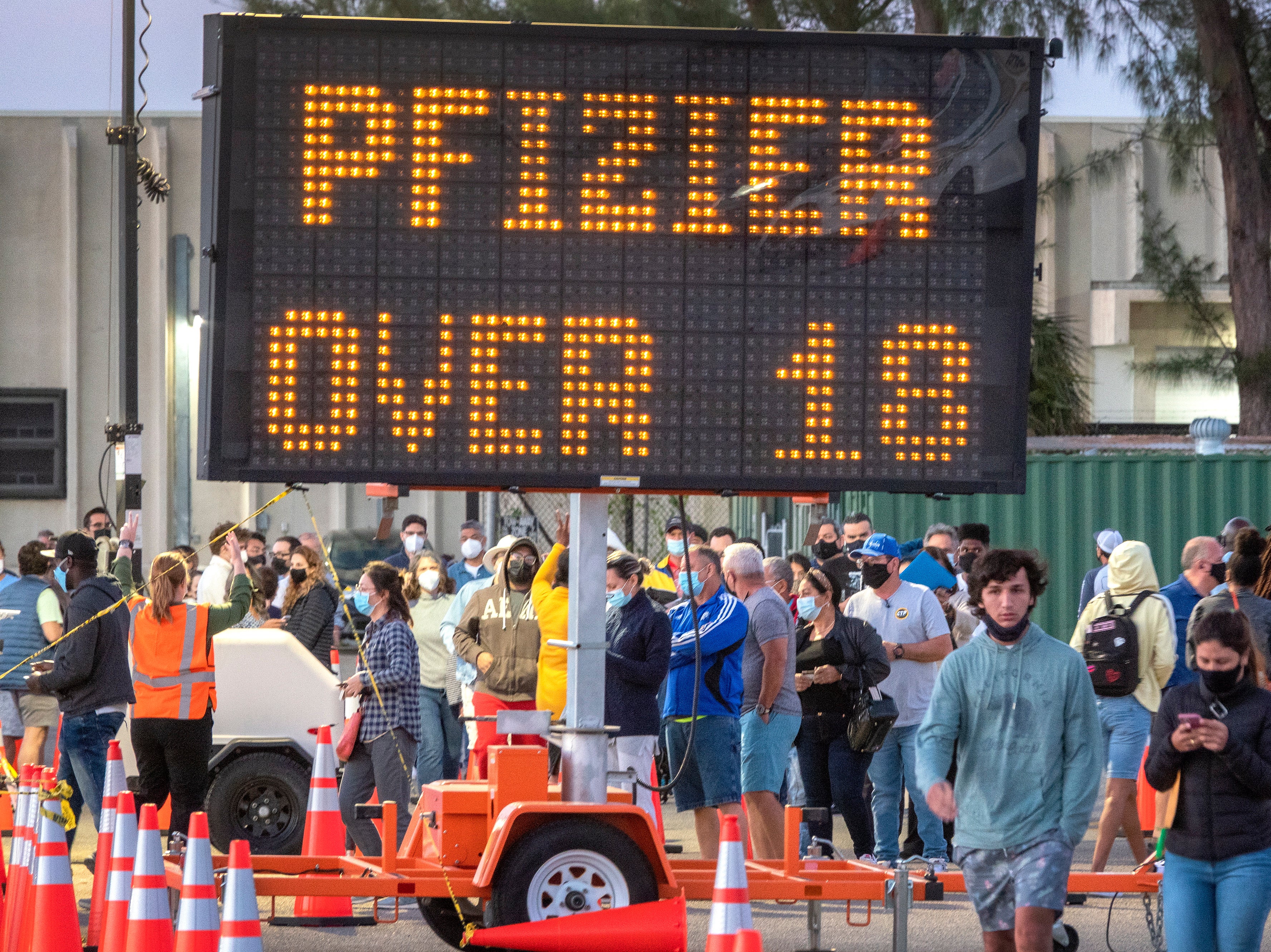 People queue in a line to get the Covid-19 Vaccine at the FEMA Vaccination site opened in Miami-Dade College in Miami, Florida, USA, 5 April 2021