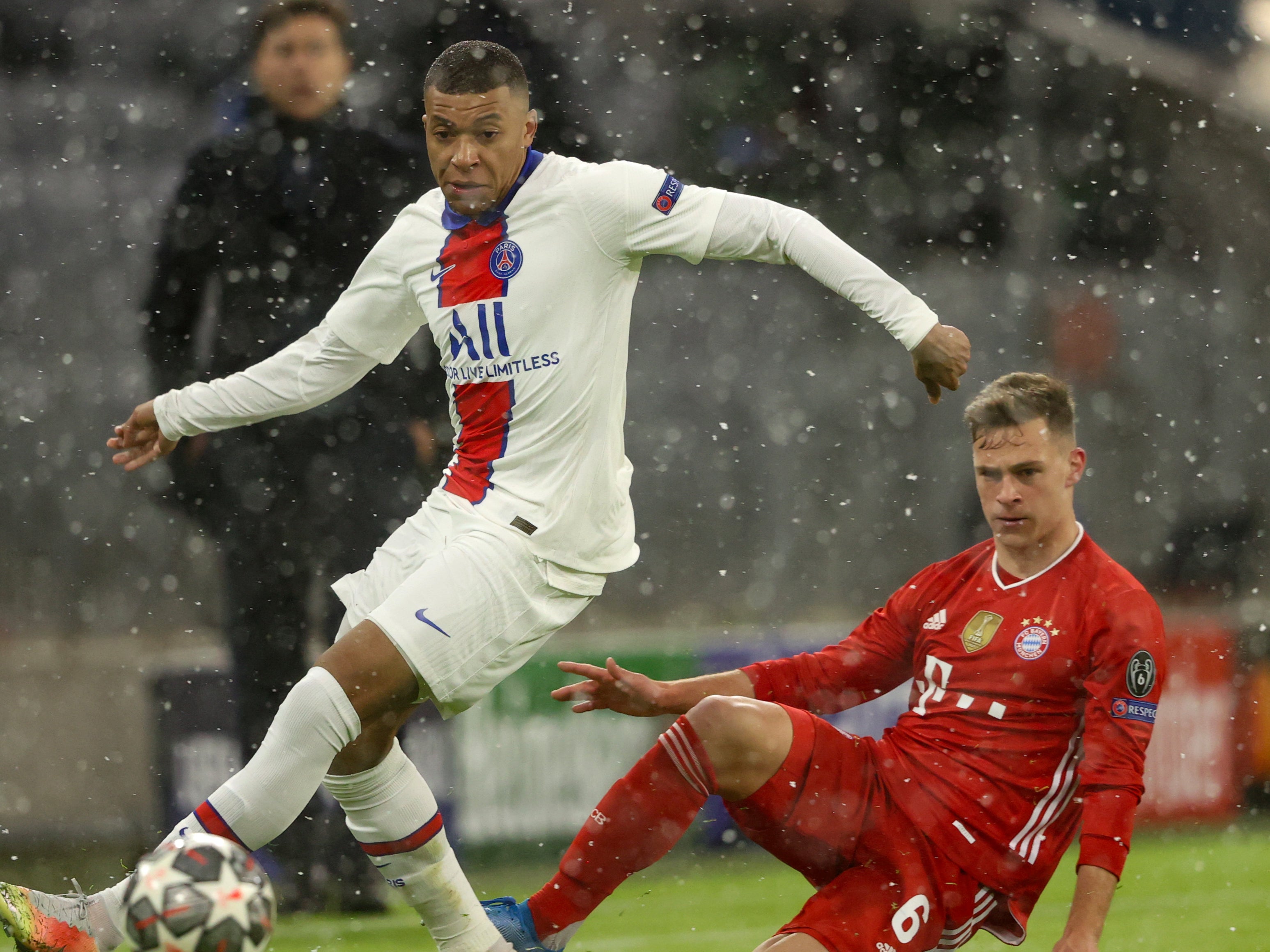 Joshua Kimmich (right) challenges Mbappe