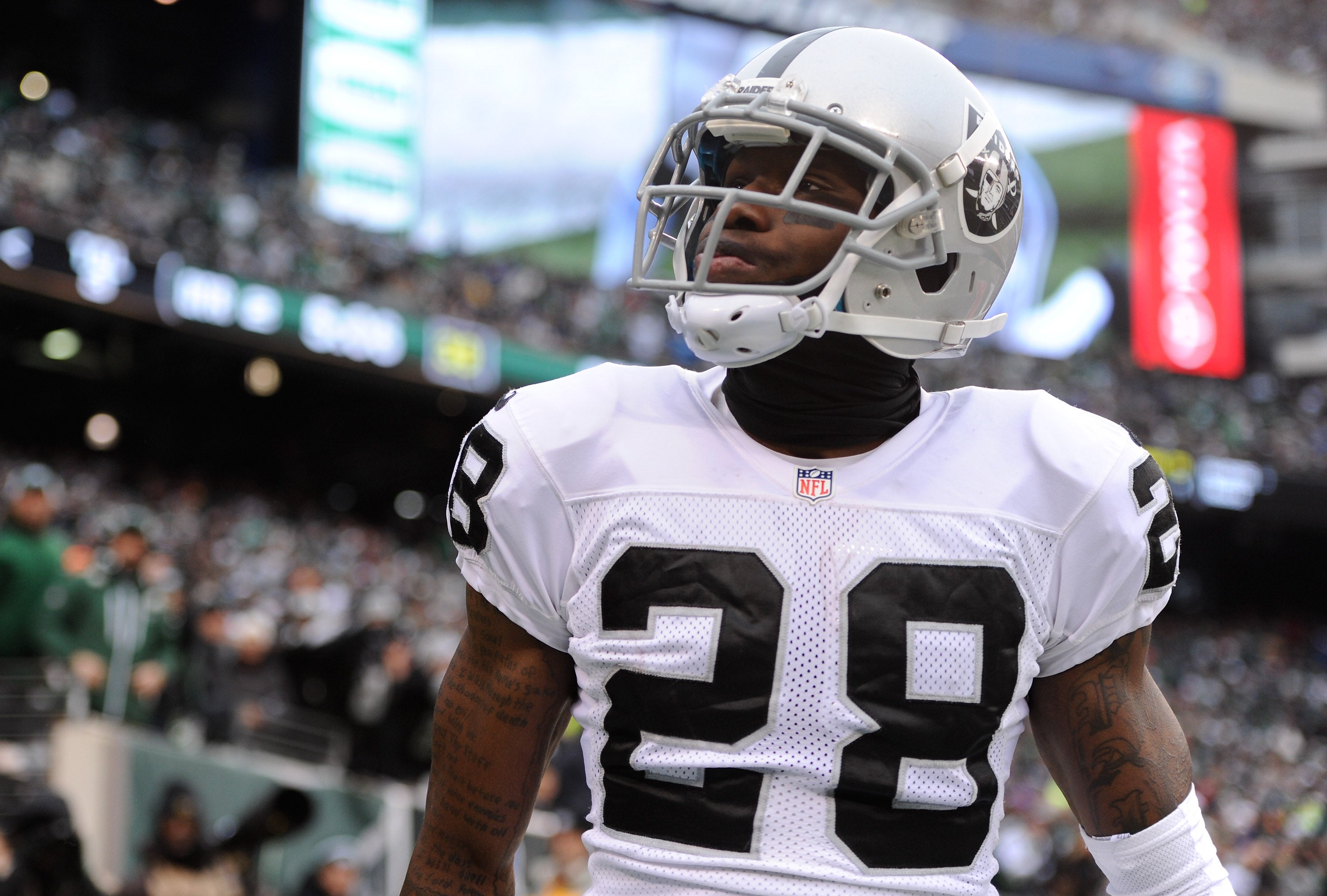 Phillip Adams #28 of the Oakland Raiders looks into the crowd during the first half against the New York Jets at MetLife Stadium on 8 December 2013 in East Rutherford, New Jersey