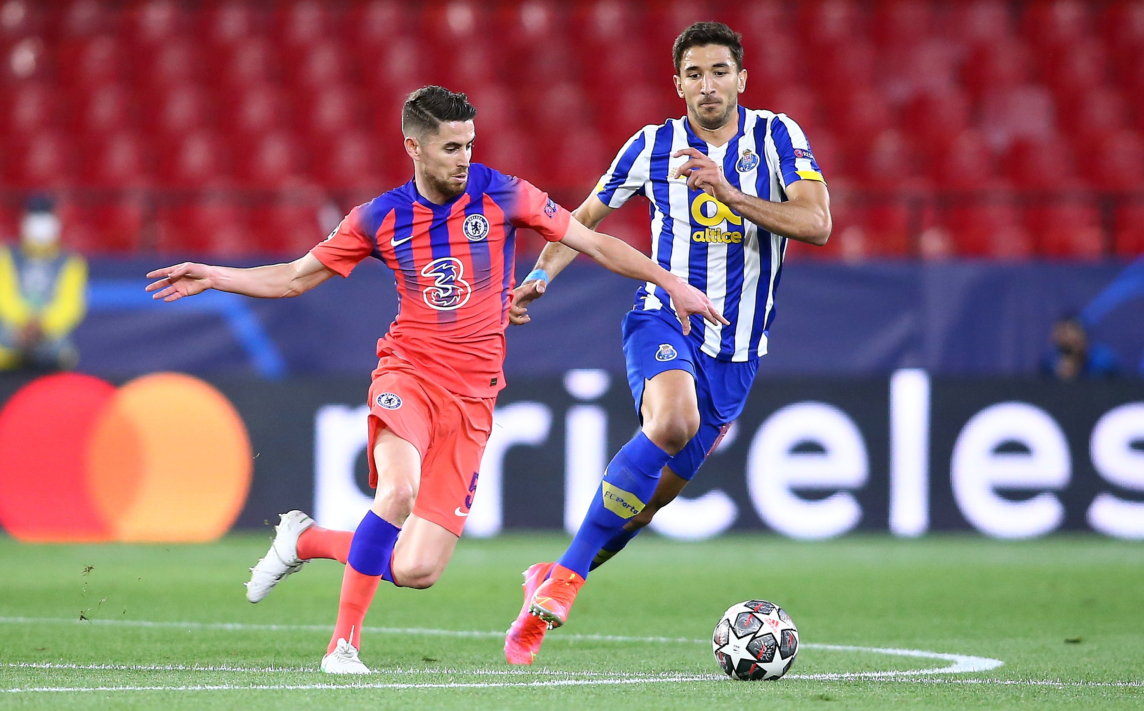 Marko Grujic of FC Porto competes for the ball with Jorginho of Chelsea