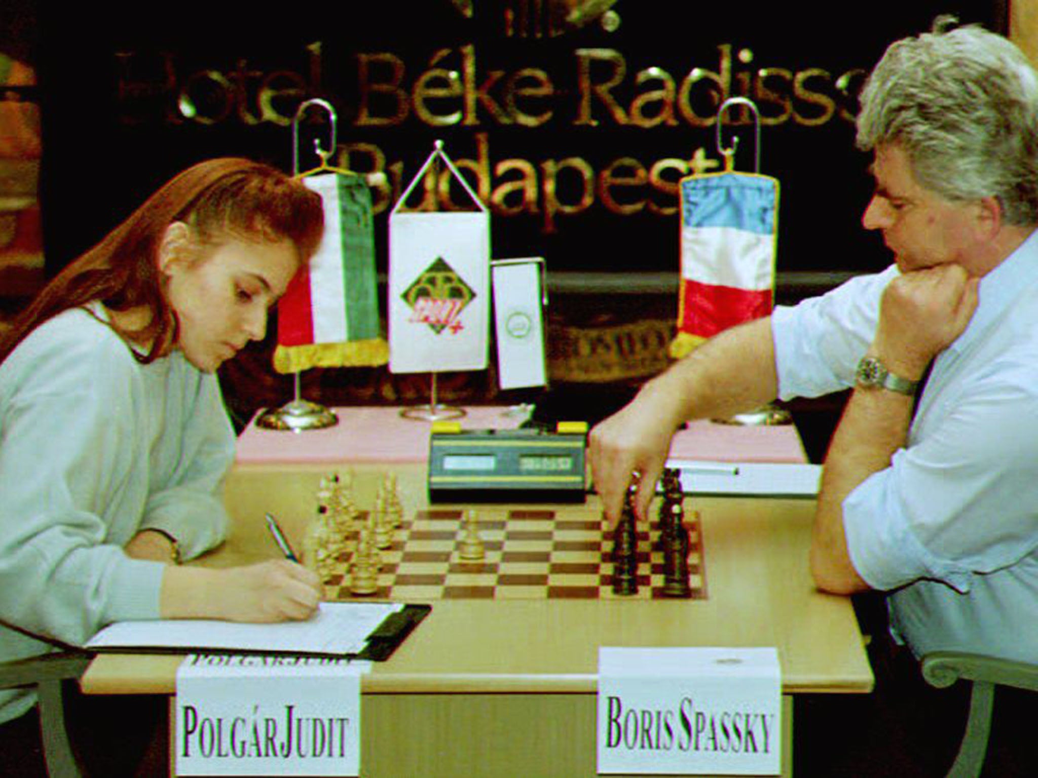 Judit Polgar, the youngest international chess grandmaster, writes down her first move in her 1993 match with chess champion Boris Spassky. She won