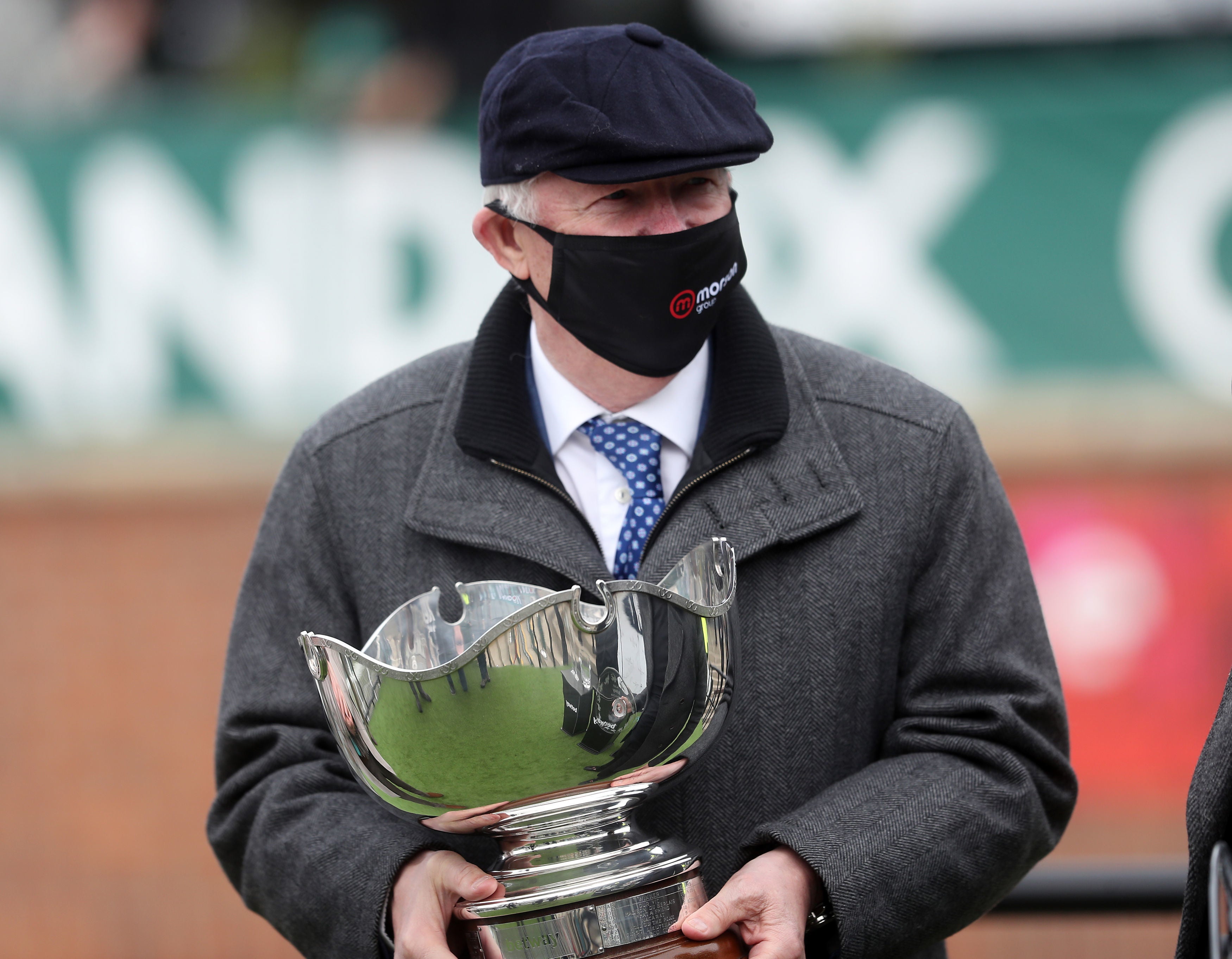 Sir Alex Ferguson with the trophy after Clan Des Obeaux won the Bowl Chase