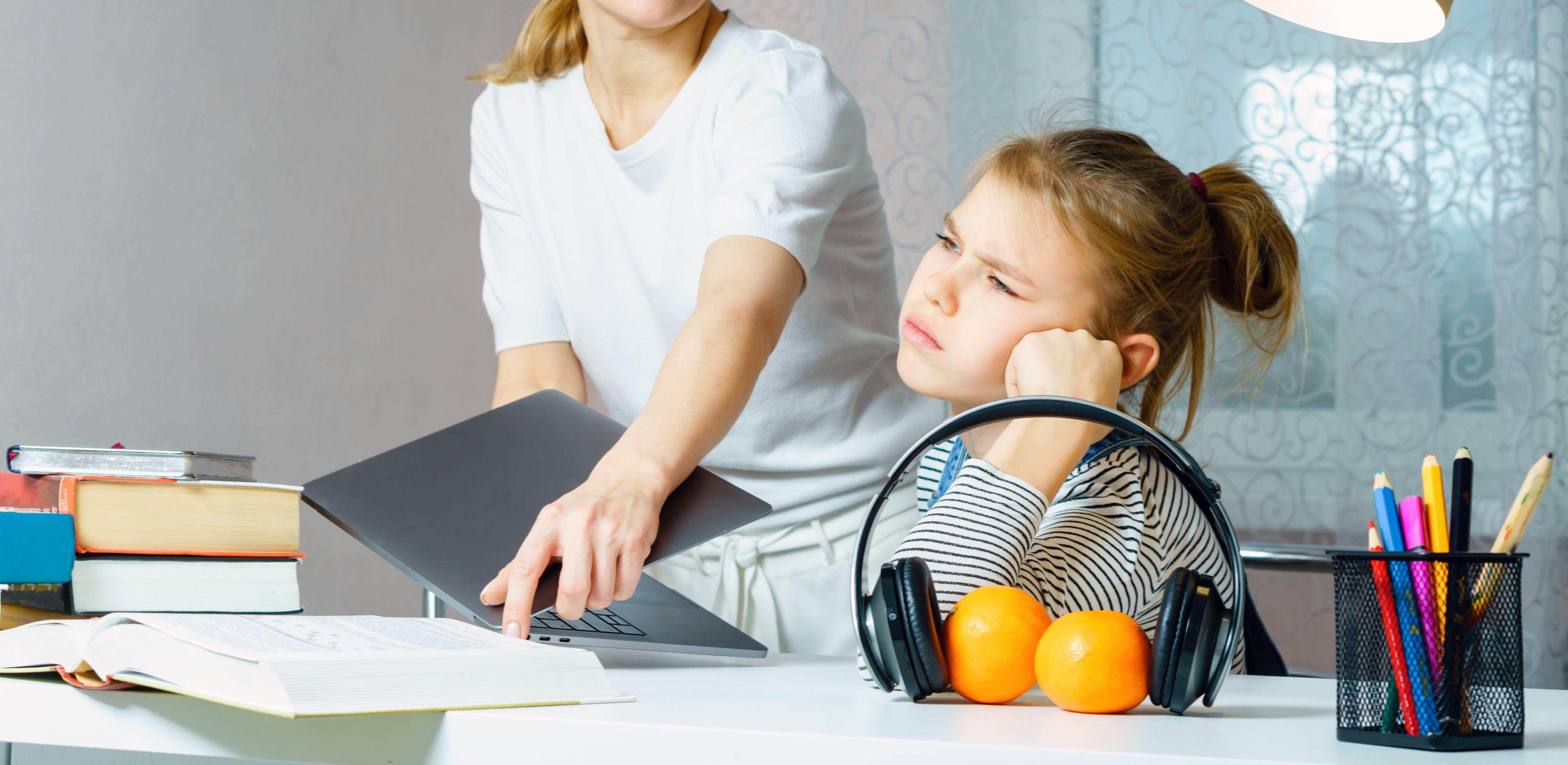 Mother Arguing With Teenage Daughter Over Online Activity