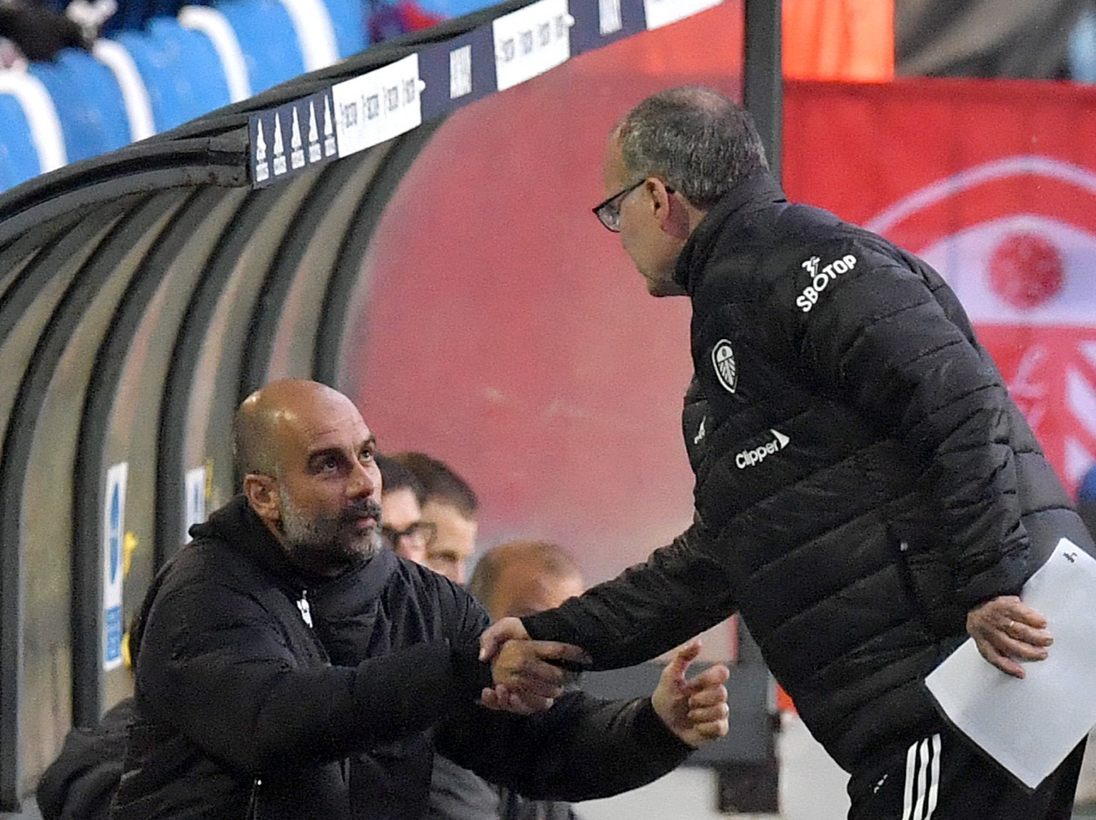 Manchester City coach Pep Guardiola (left) with Leeds boss Marcelo Bielsa