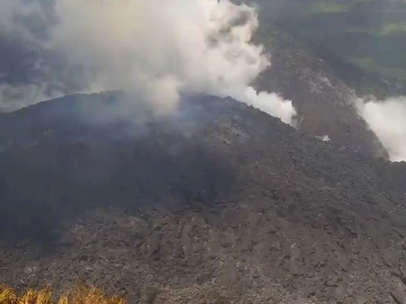 Smoke spews from the dome of the La Soufriere volcano in St Vincent and the Grenadines