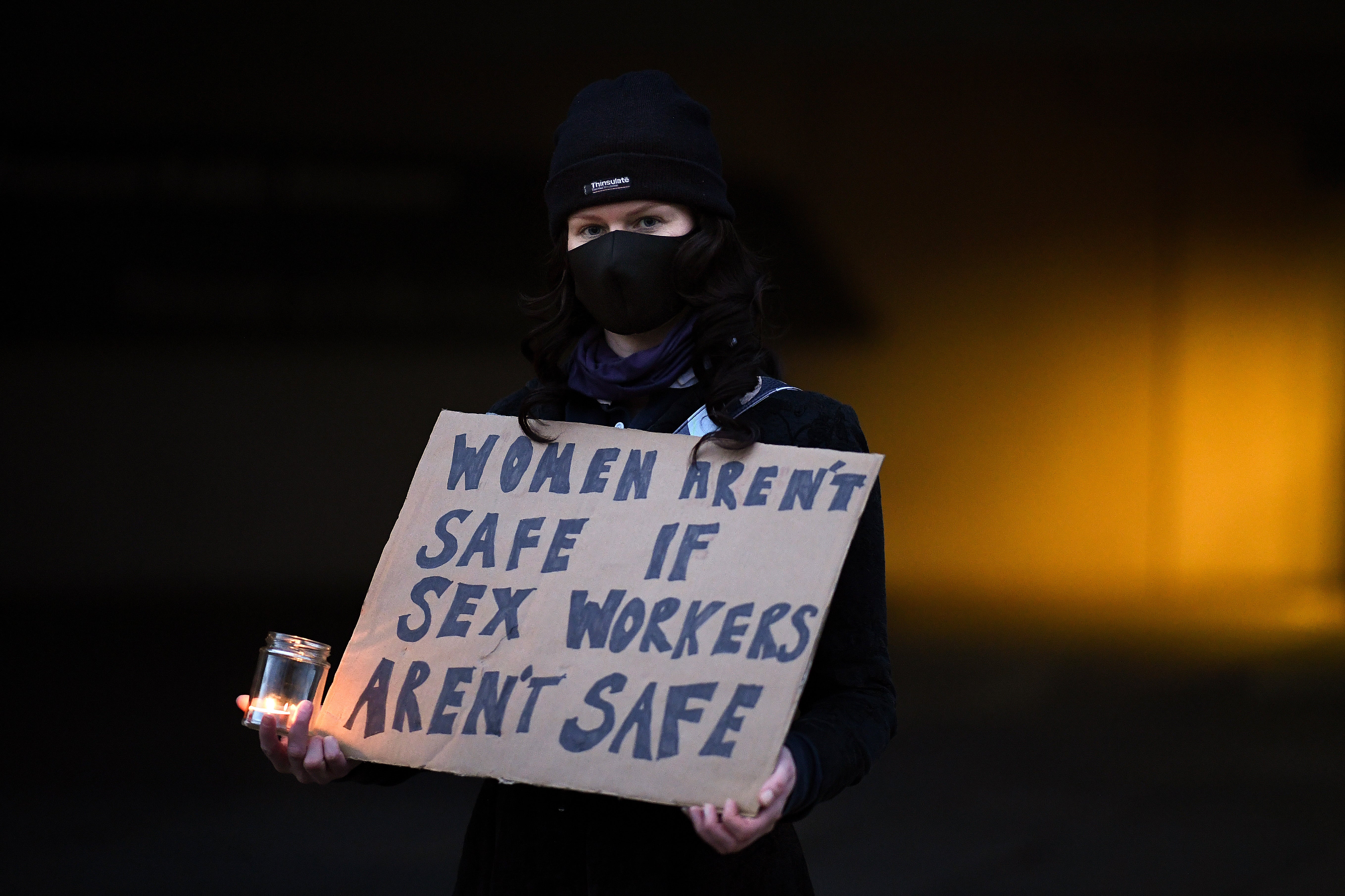 Sex workers and campaigners hold vigil outside Scottish Parliament on 25 November in Edinburgh