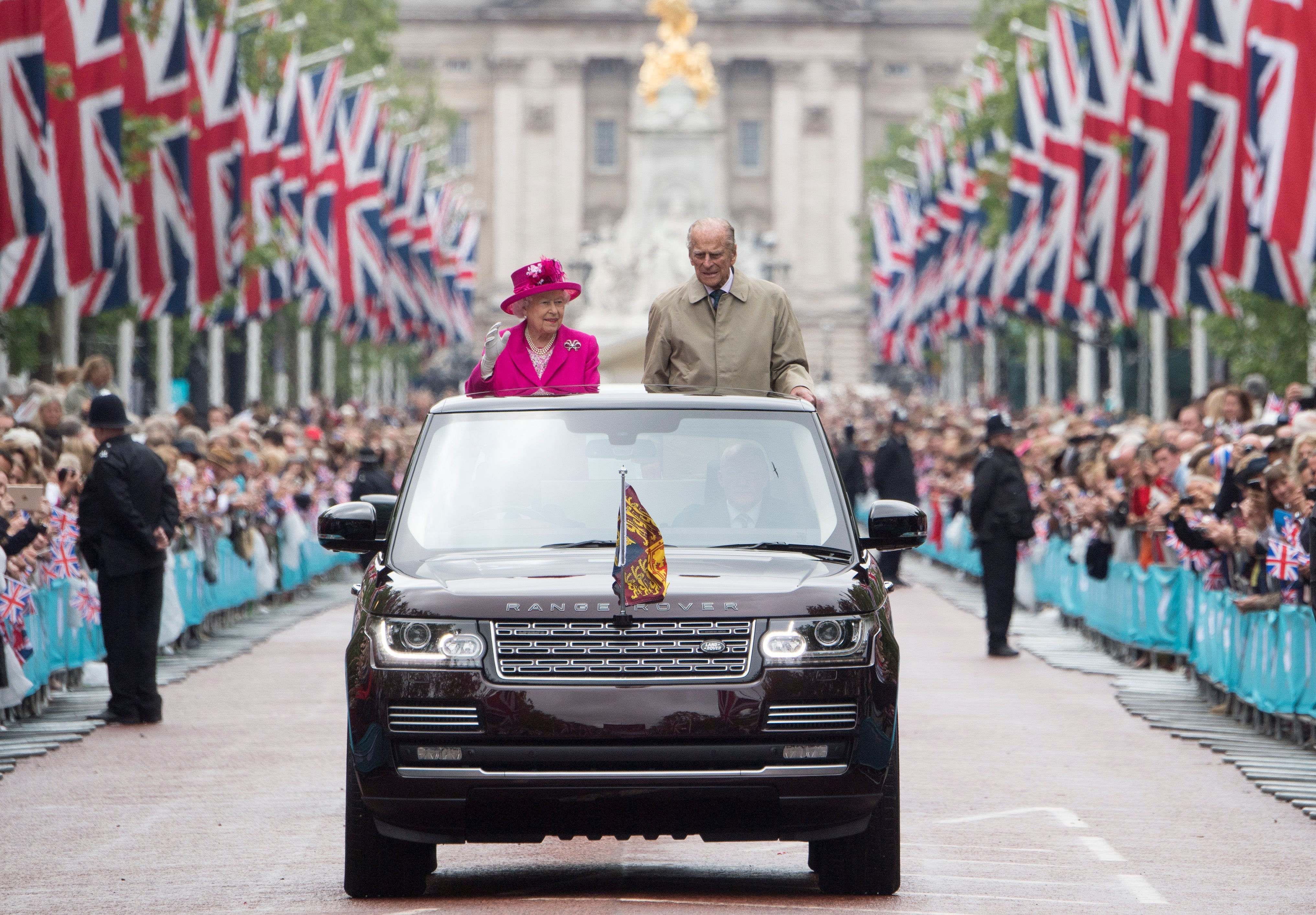 12 June 2016: Queen Elizabeth II and Prince Philip, Duke of Edinburgh wave to guests attending "The Patron's Lunch" celebrations for The Queen's 90th birthday on The Mall