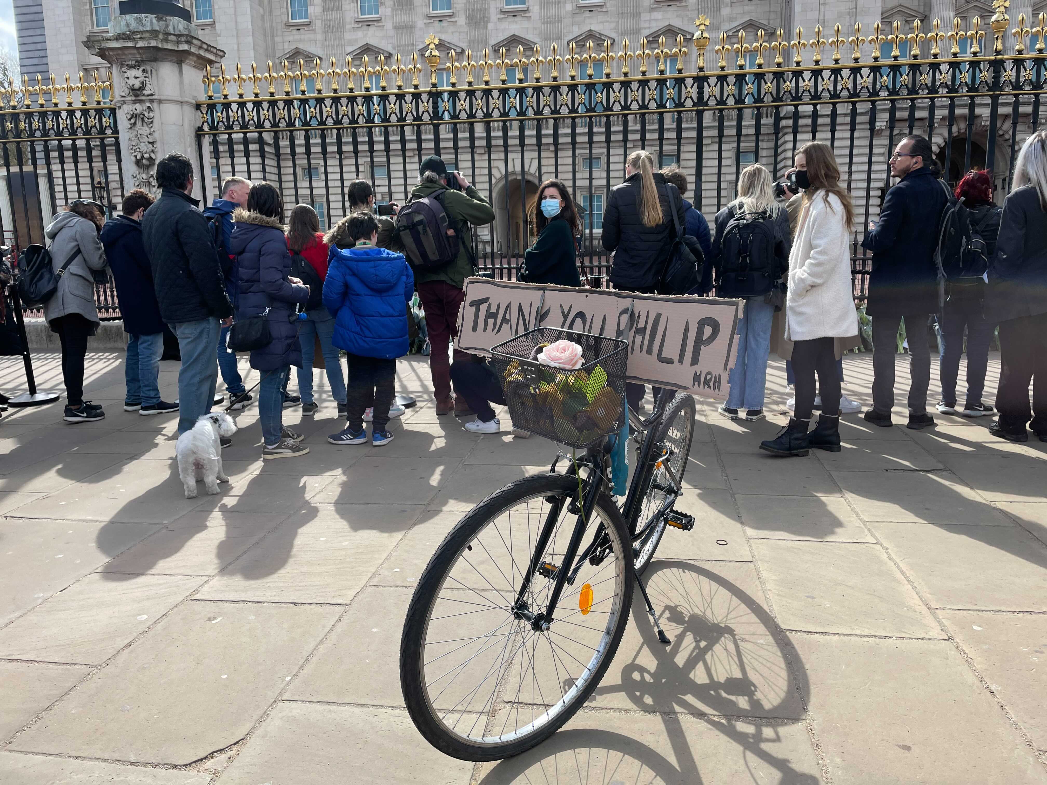 One well-wisher leaves a sign saying “Thank you Philip” outside Buckingham Palace.