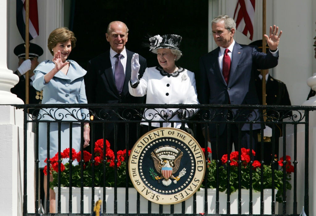 President George W Bush, Queen Elizabeth II, Prince Philip and First Lady Laura Bush wave after an arrival ceremony at the White House in May 2007