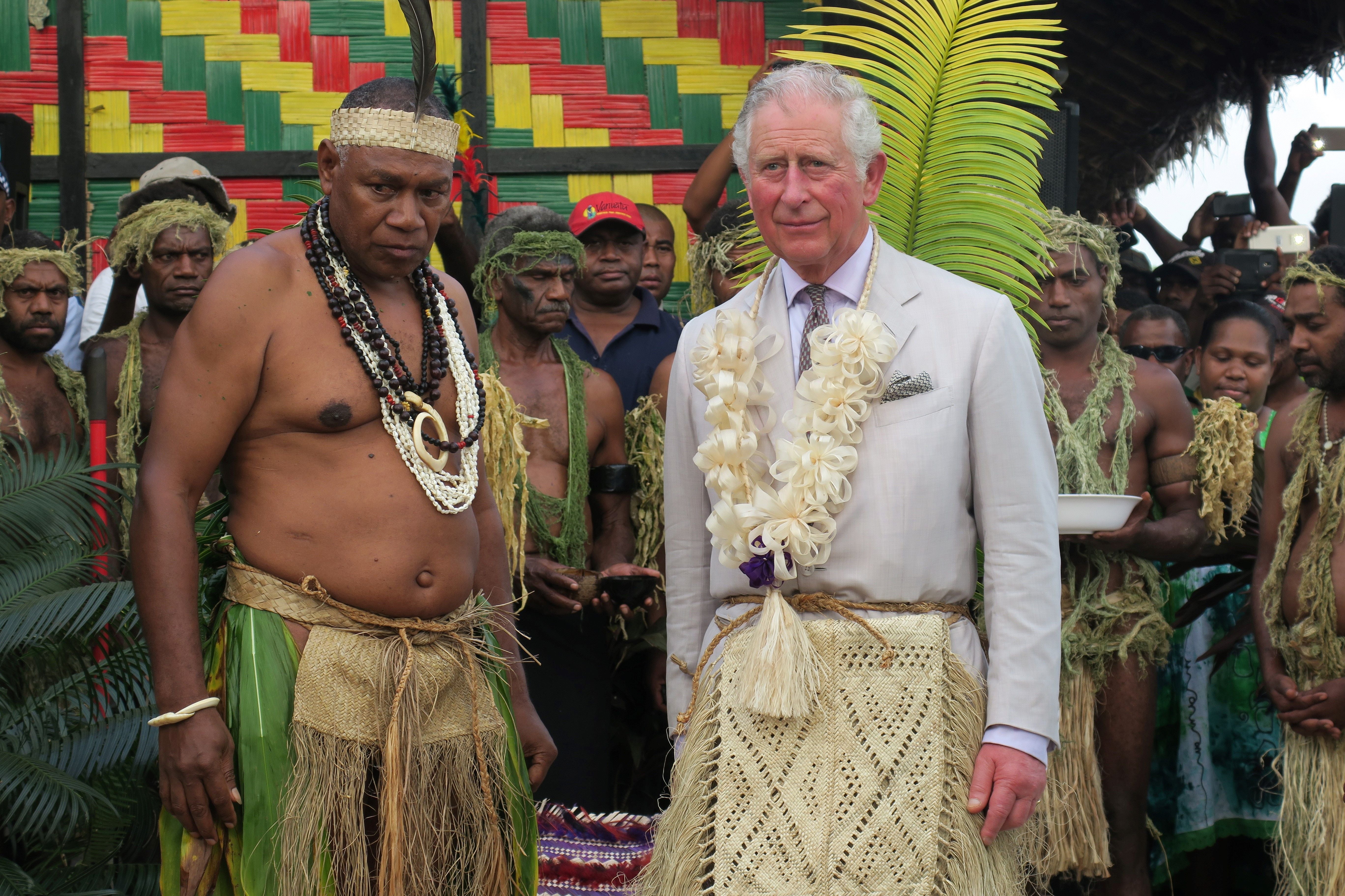 Prince Charles stands with the President of the Malvatumauri Council of Chiefs during a visit to Vanuatu