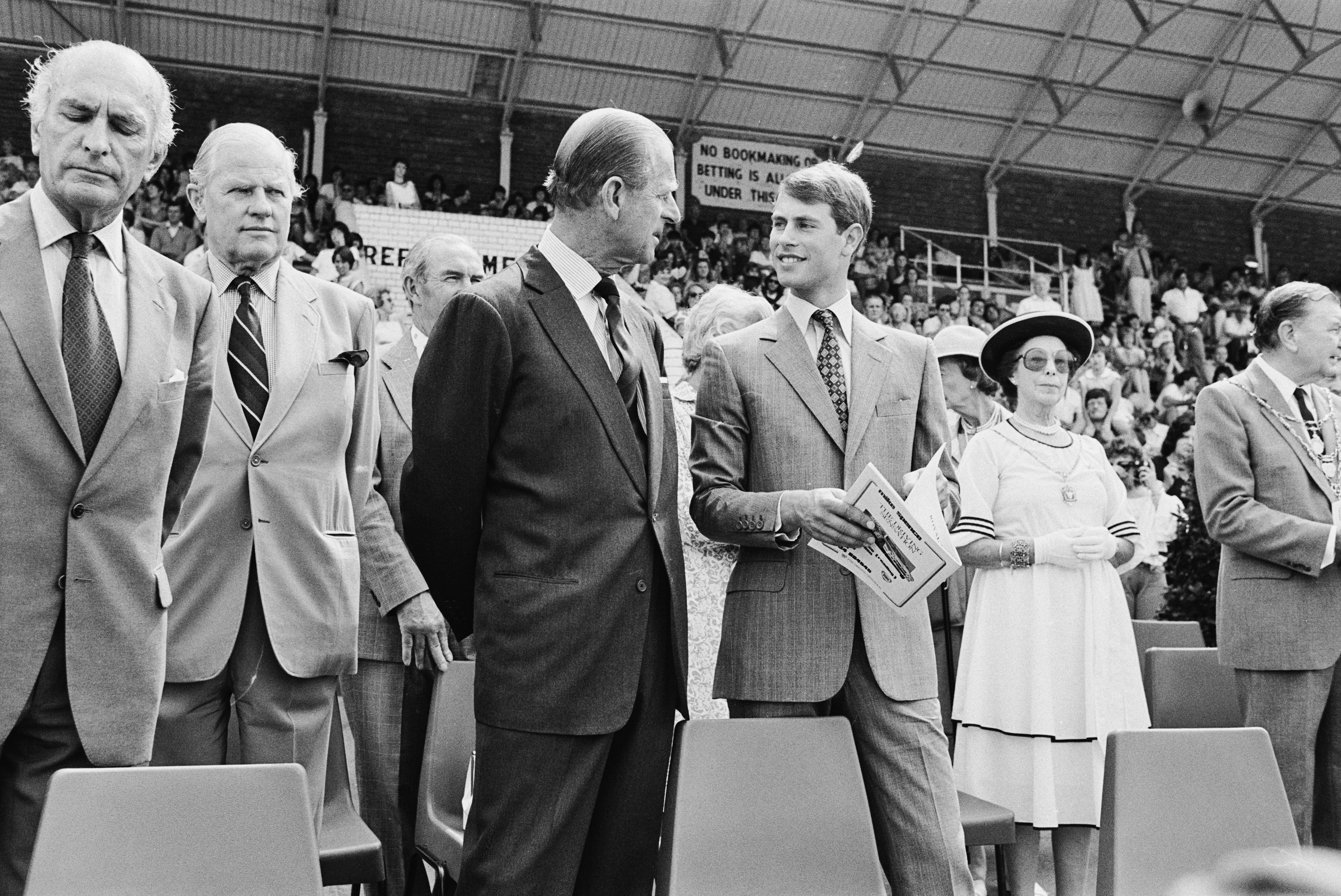 Prince Philip pictured with his youngest son, Prince Edward. at a Royal Ascot charity even in July 1984.