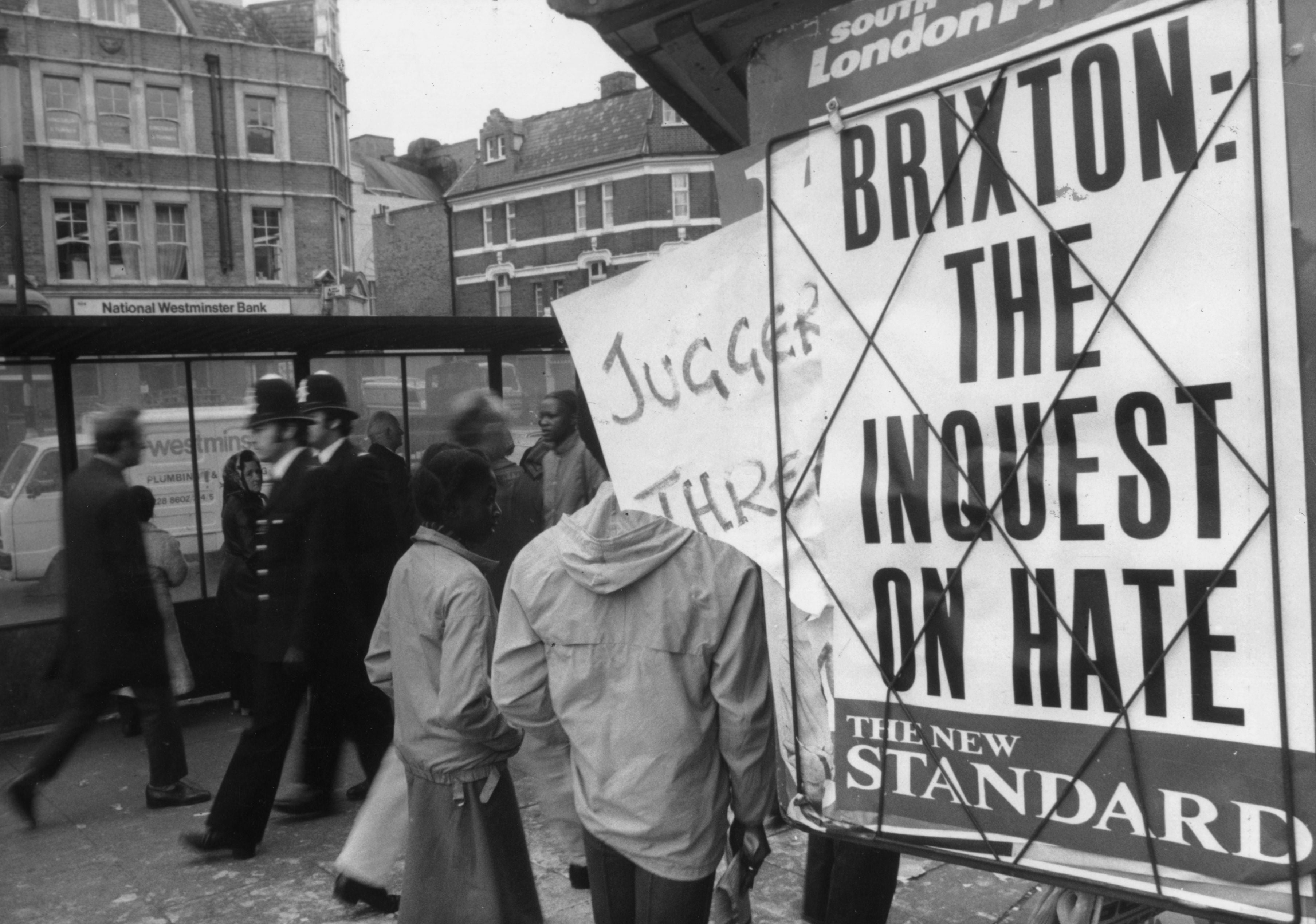 Two policeman on the Brixton Road during the riots of 1981