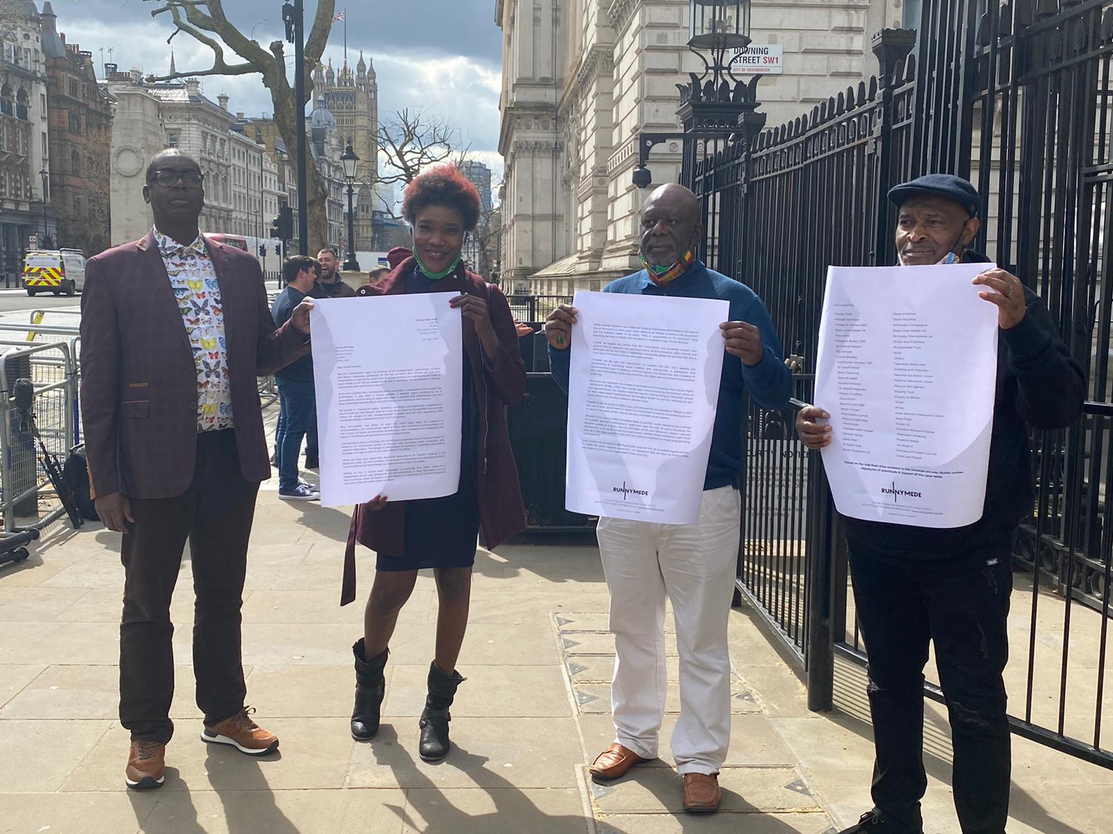 Patrick Vernon OBE, Tishuana Mullins and Michael Hamilton from social enterprise Ubele Initiative and Windrush survivor Anthony Bryan, delivering petition to Downing Street.