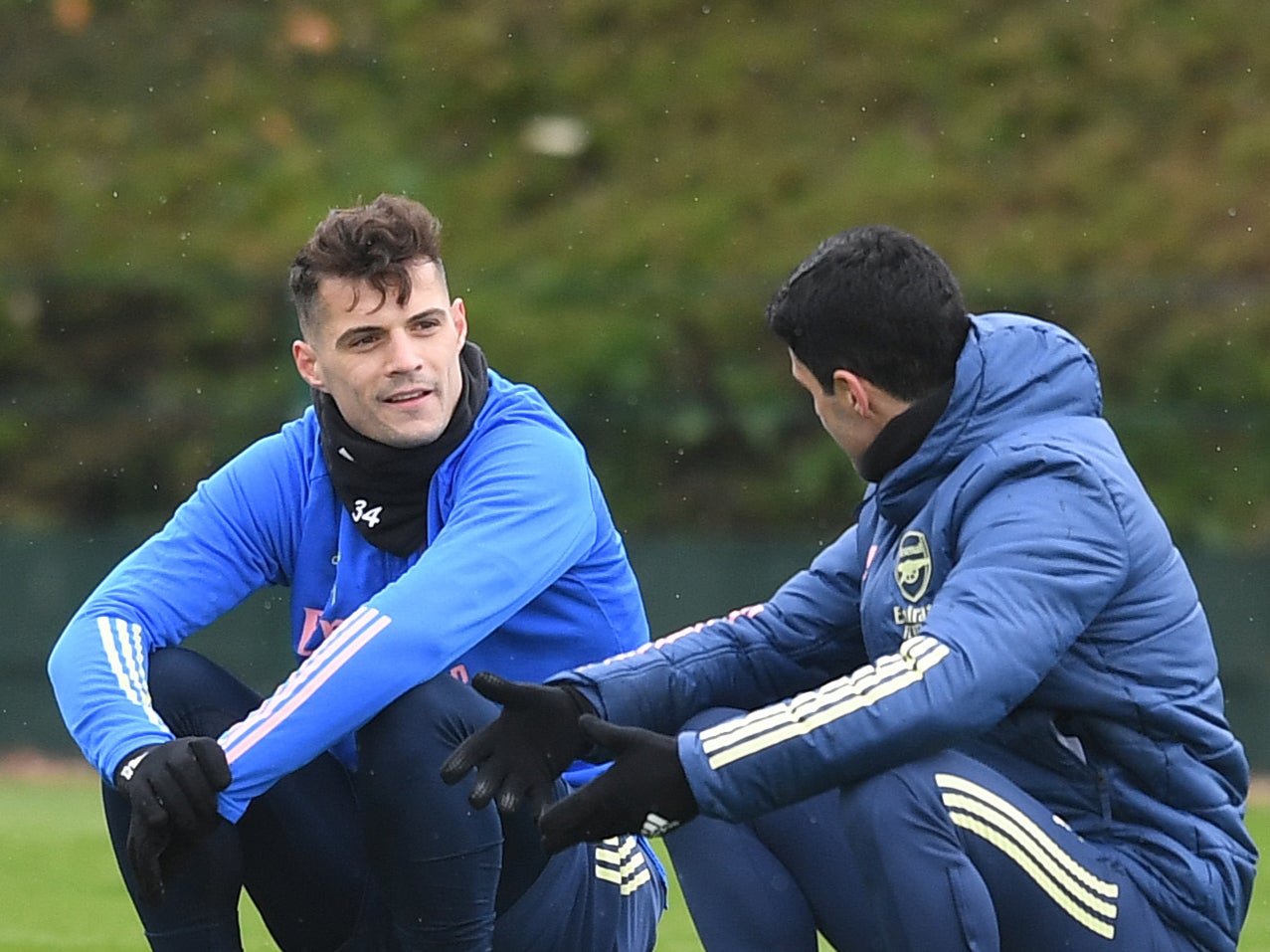 Arsenal midfielder Granit Xhaka (left) with coach Mikel Arteta