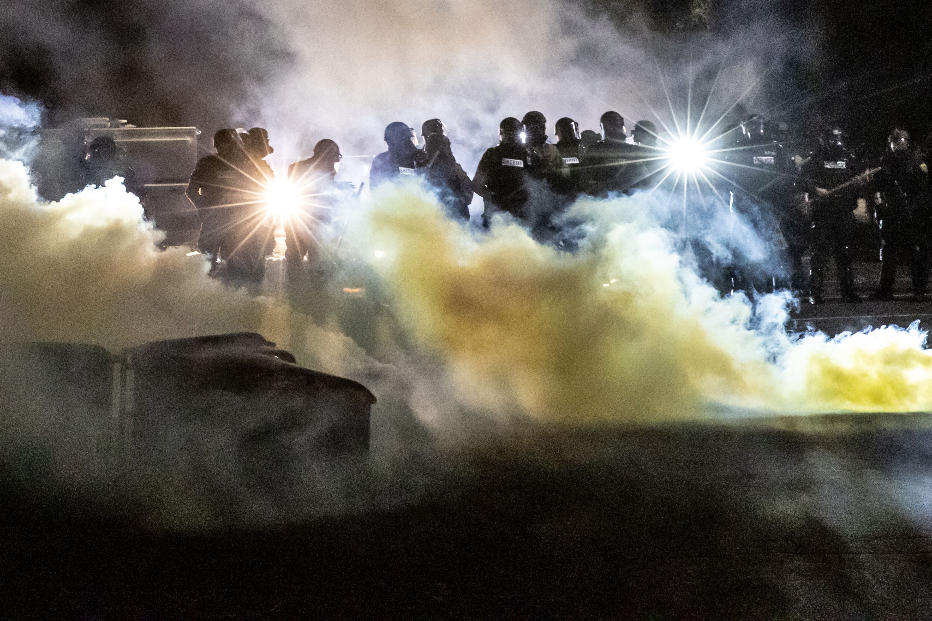 Police used tear gas to move people after protesters gathered at Brooklyn Center Police headquarters