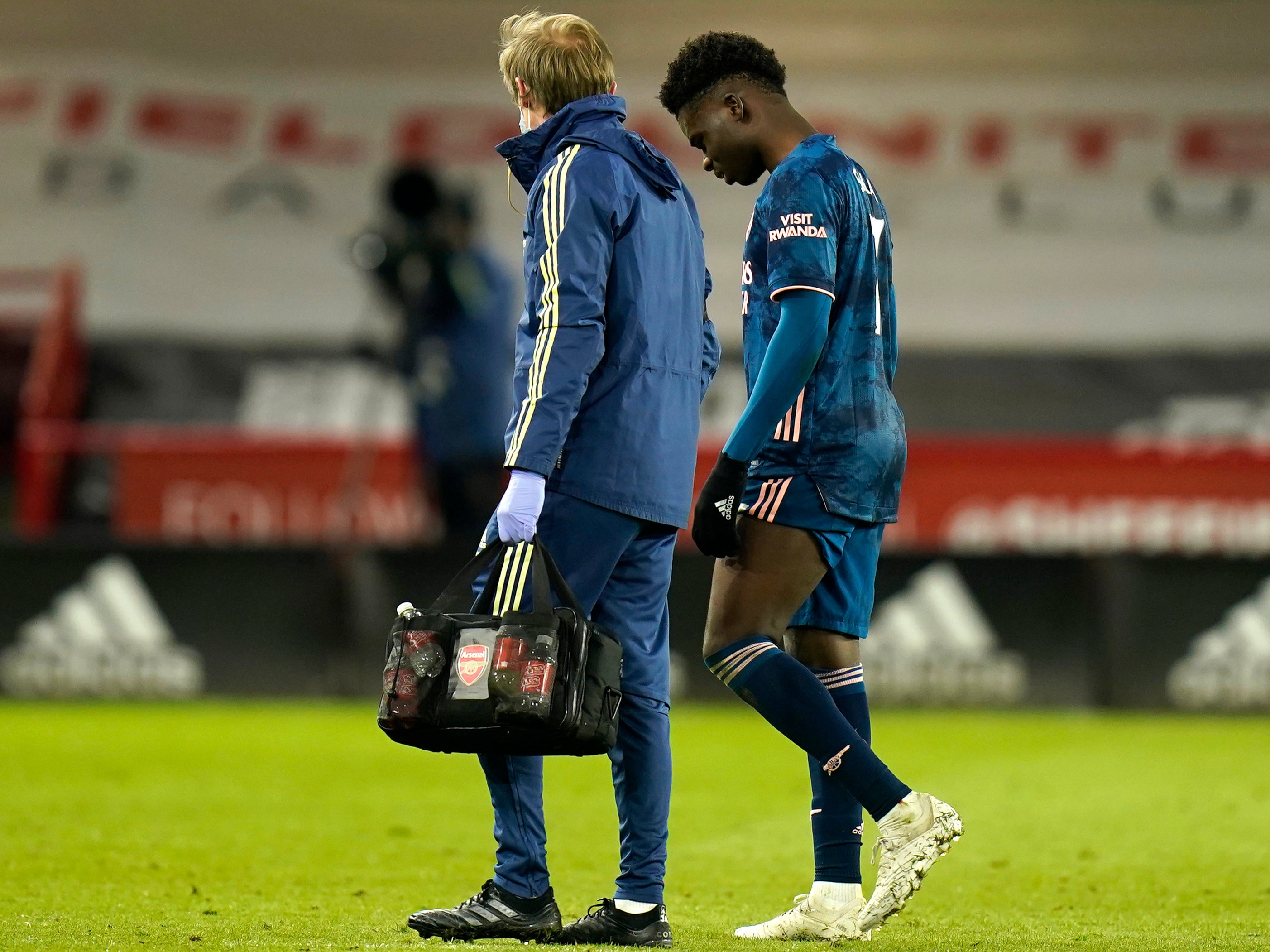 Saka departed injured against the Blades