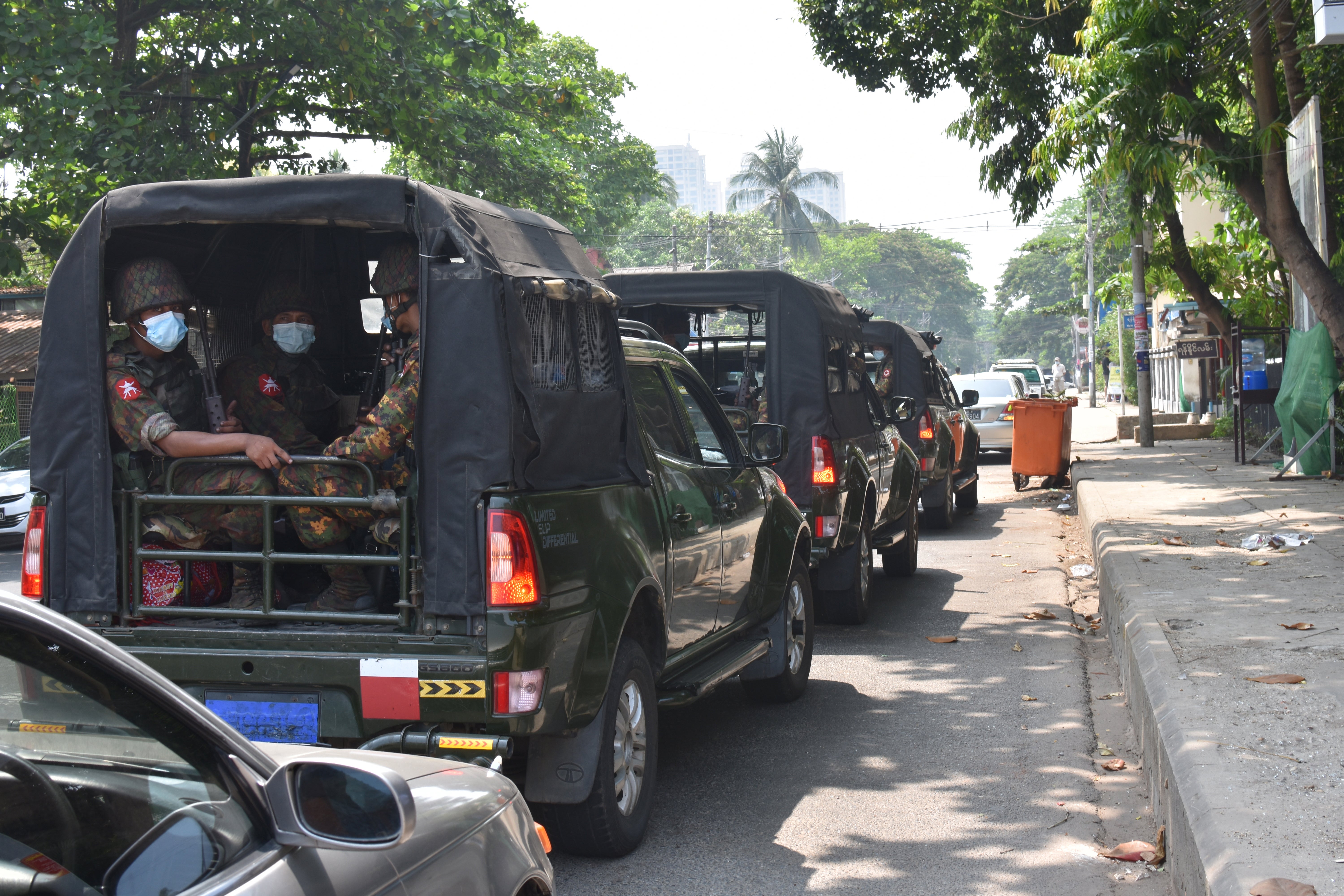 Three of the vehicles in the military convoy that escorted journalists on the first day of the tour in Yangon