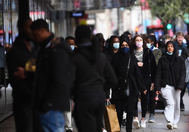 <p>Shoppers on Oxford Street, London, as England takes another step back towards normality with the further easing of lockdown restrictions</p>