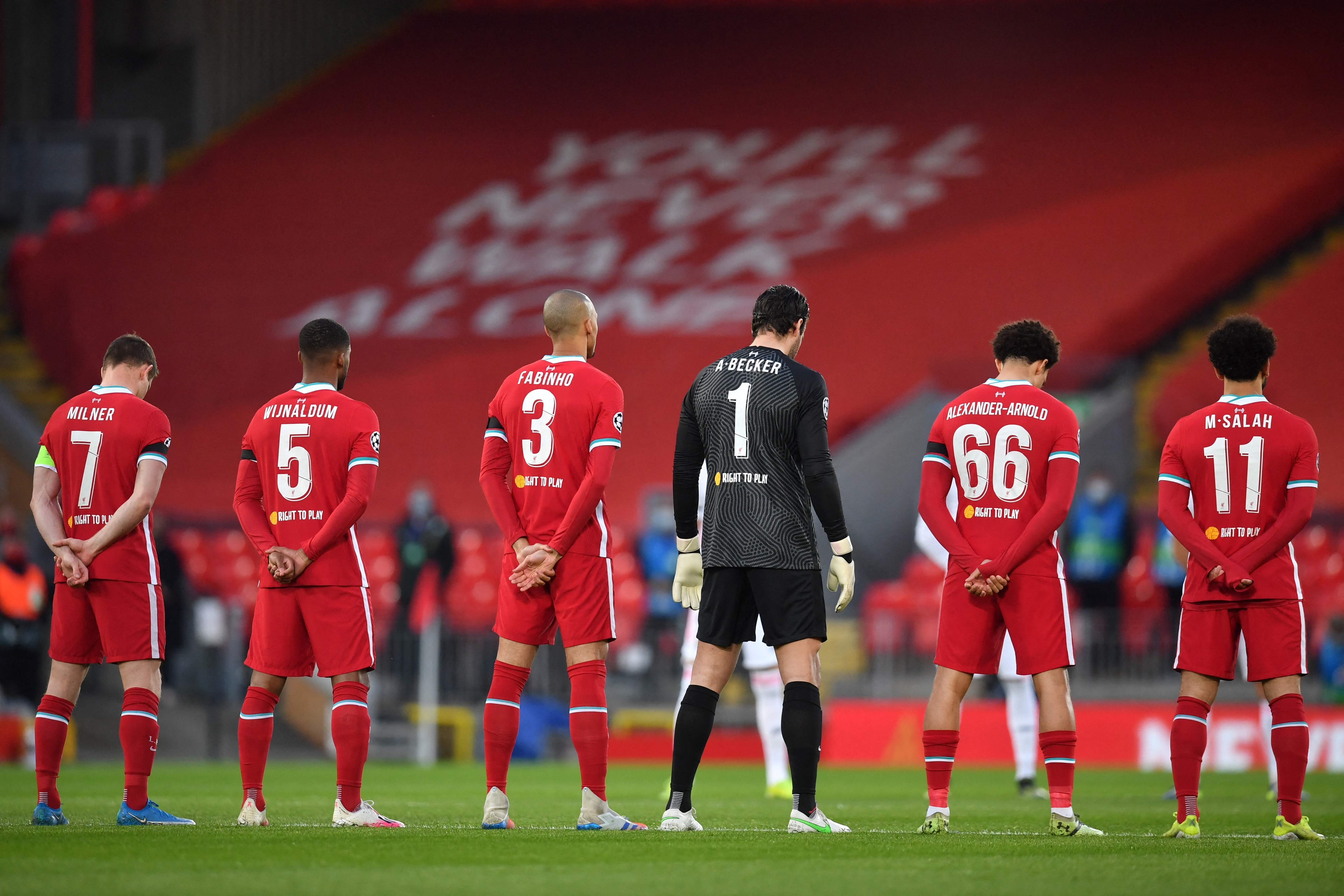 Liverpool players stand for a minute’s silence on the eve of the 32nd anniversary