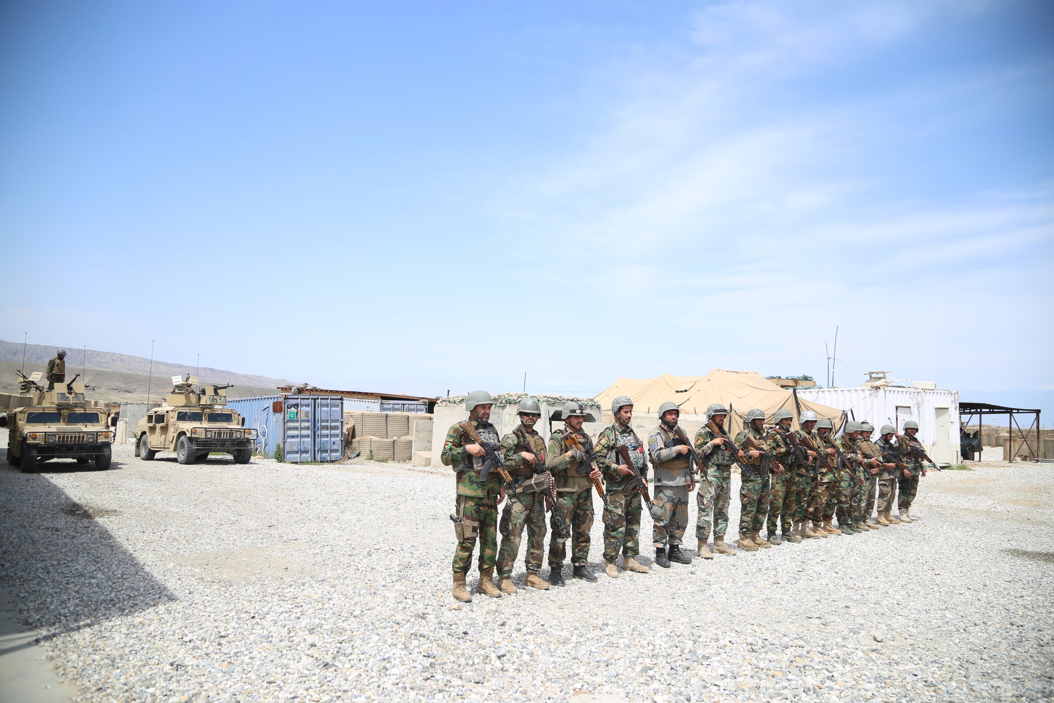 Afghan army soldiers secure a military base that was previously in use by US soldiers, in Haska Meyna district of Nangarhar province, 14 April 2021