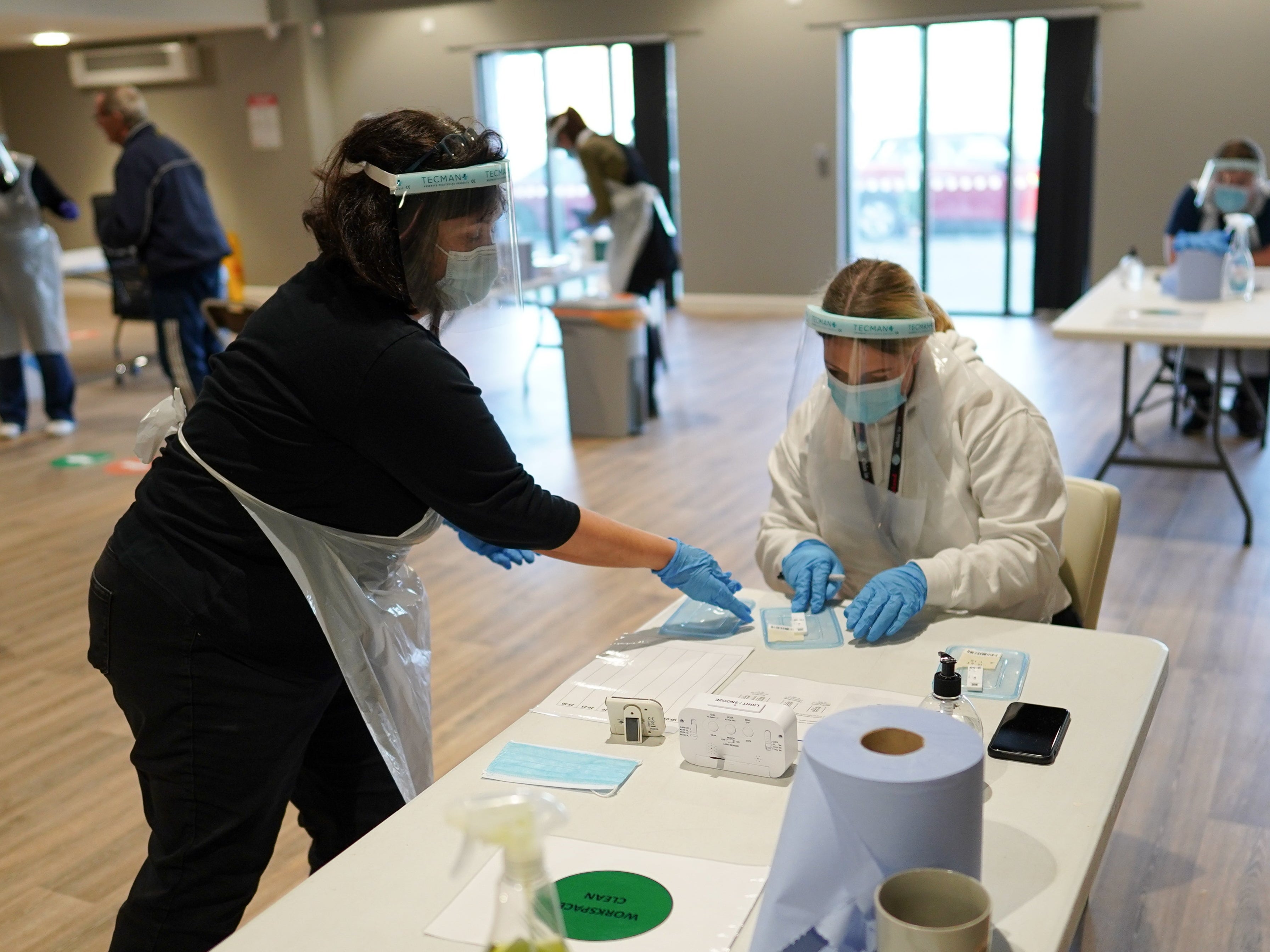 Support practitioners from Redcar and Cleveland Borough Council process lateral flow tests during a community testing pilot scheme on December 15, 2020