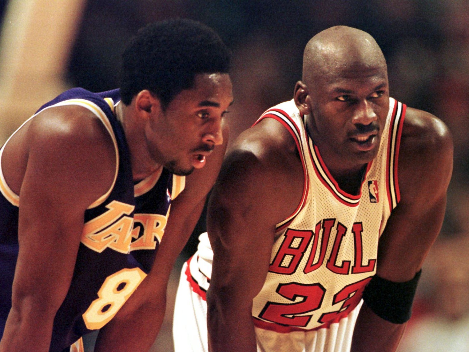 Kobe Bryant (left) on court with Michael Jordan