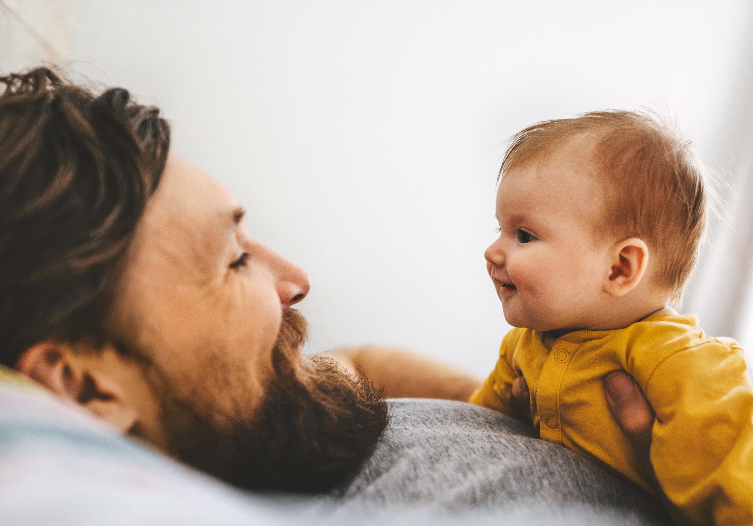 man talking to baby