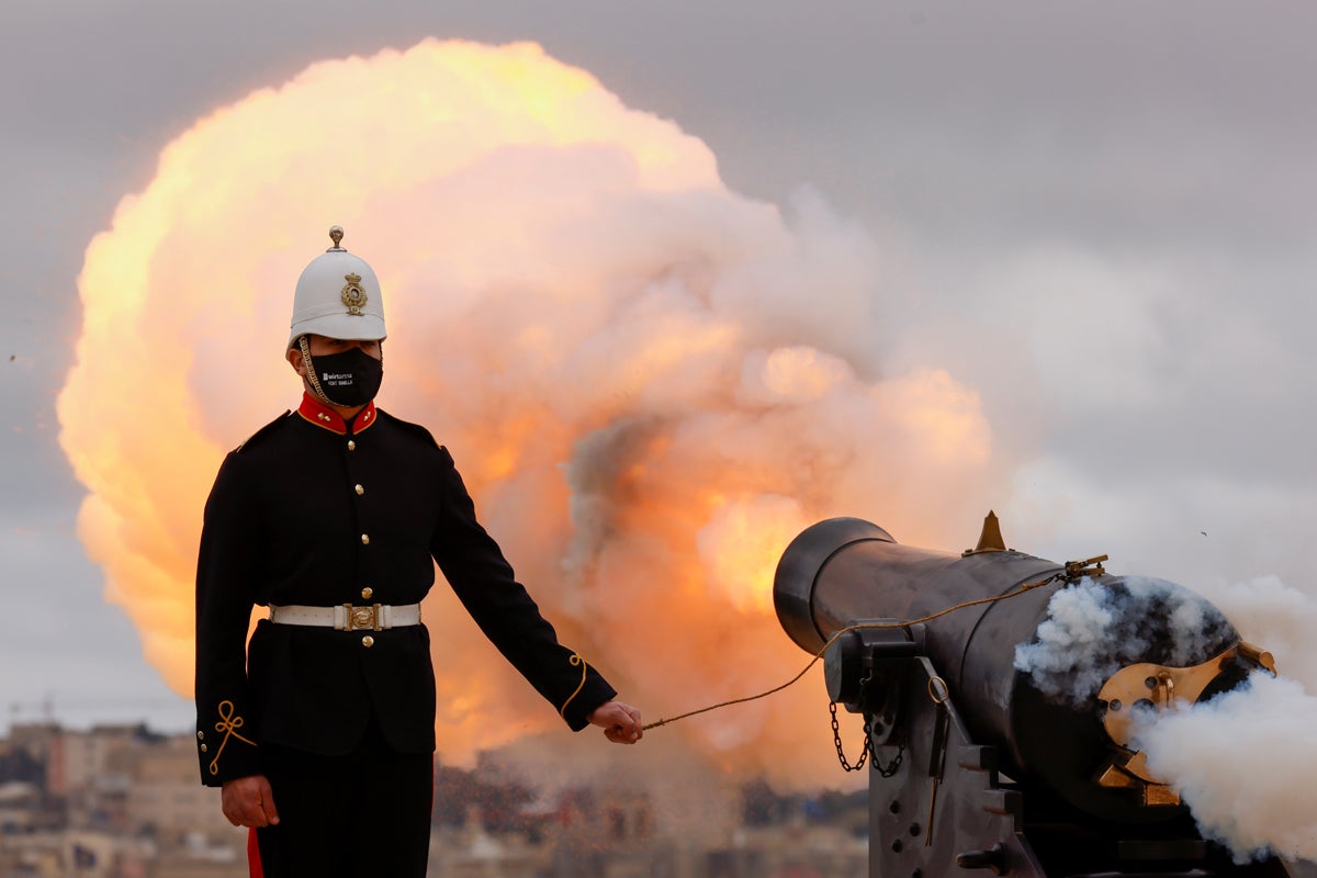Reenactors of the Malta Heritage Trust fire a nine-gun salute to honour Britain's Prince Philip before his funeral, at the Upper Barrakka Saluting Battery overlooking Grand Harbour, in Valletta, Malta