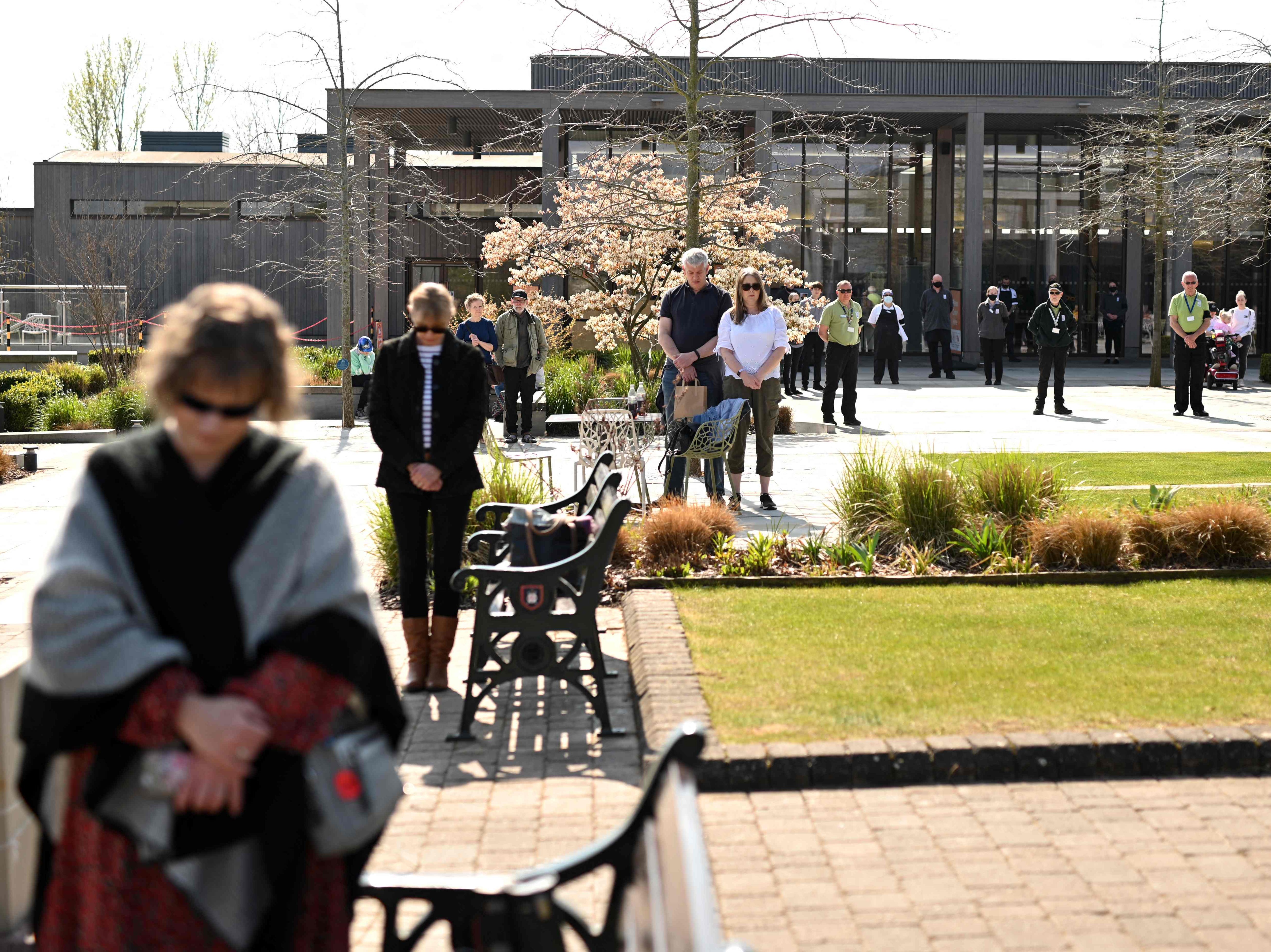 Members of the public observe a minute's silence at The National Memorial Arboretum at Alrewas in central England