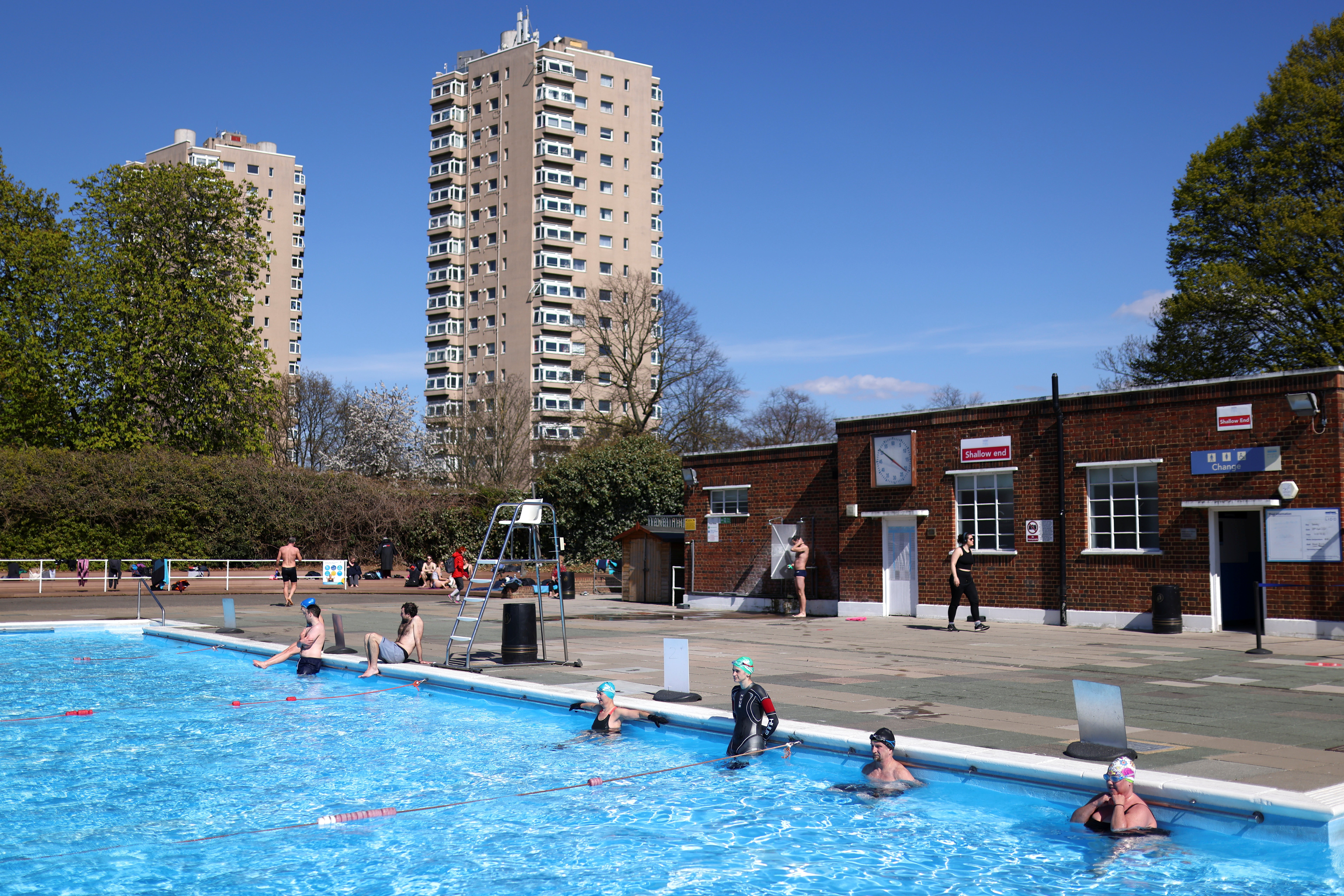 Cold water swimmers observe a minute’s silence at the Brockwell Lido in London