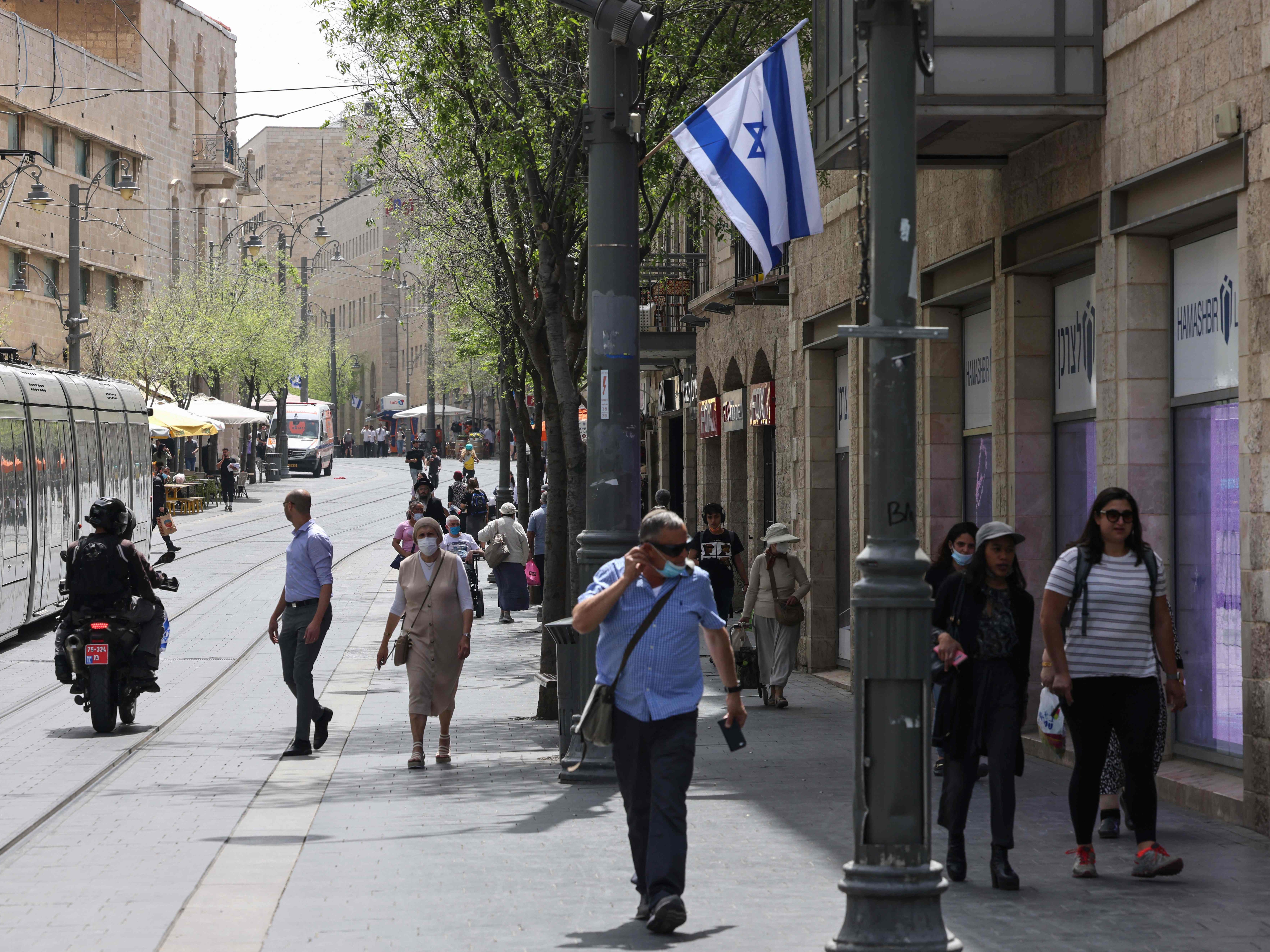 The mandatory wearing of face masks in outdoor public spaces, ordered a year ago, was scrapped on Sunday